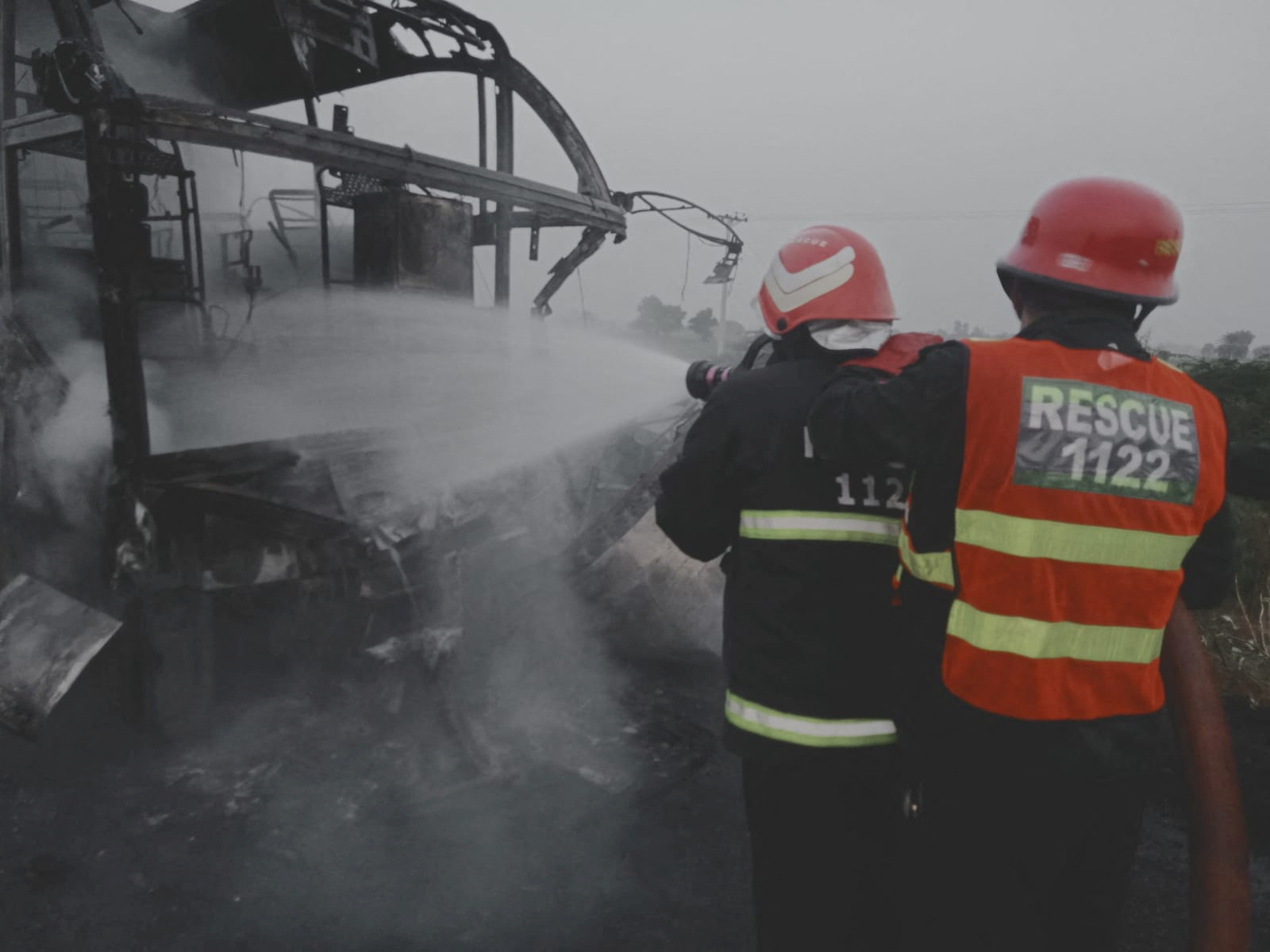 Rescue workers save people from a building fire in Pakistan