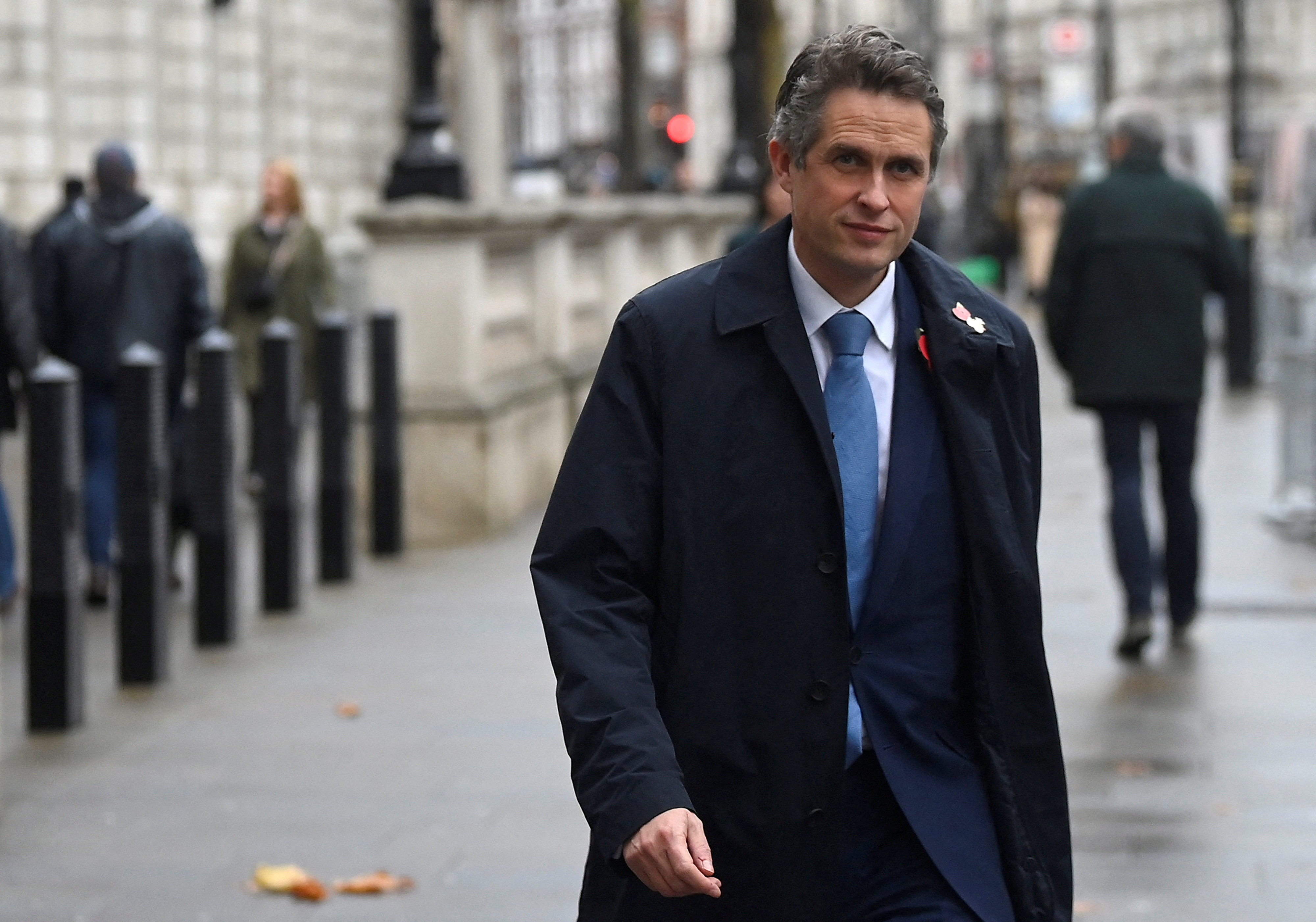 British Minister of State without portfolio Williamson walks in London