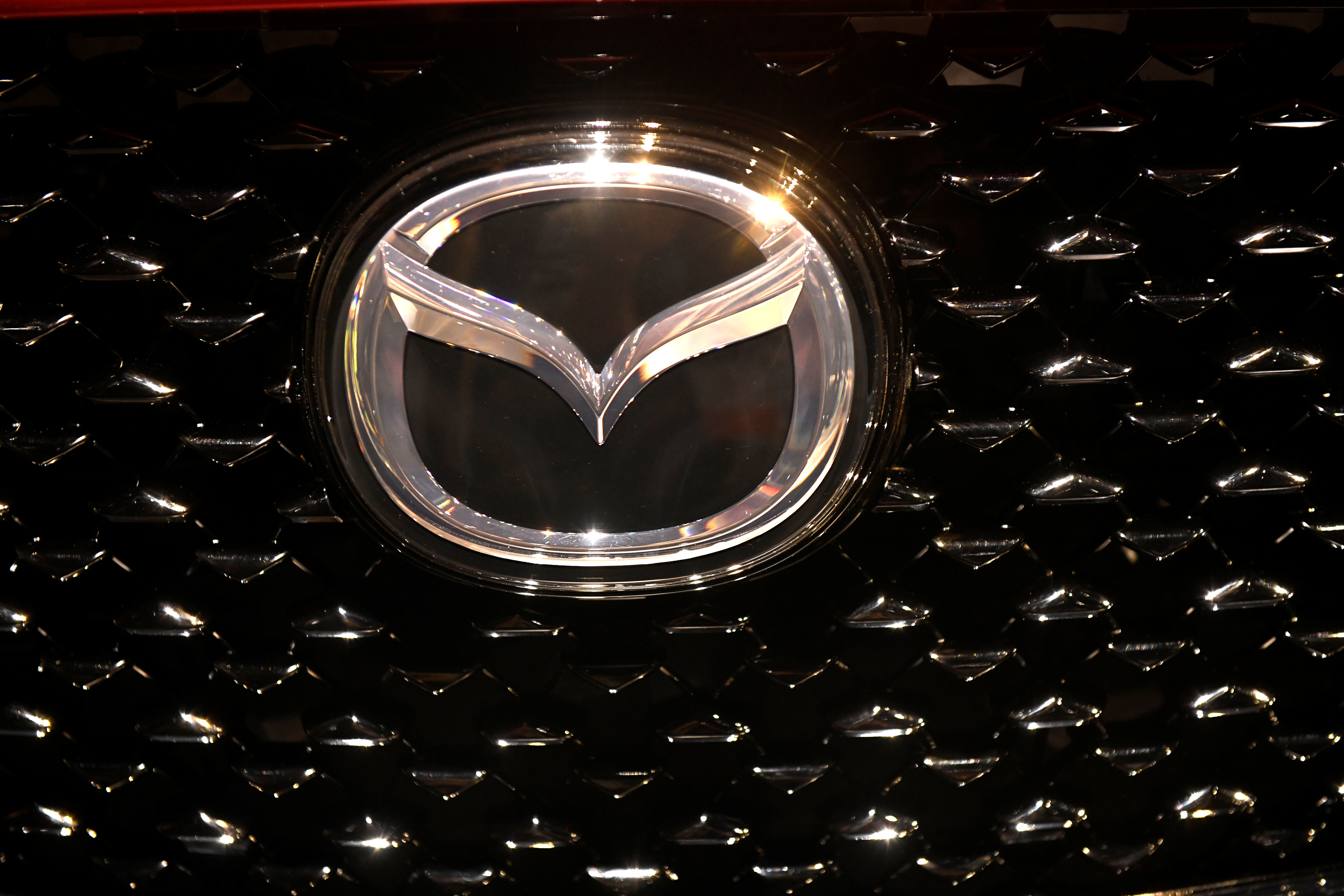 The logo of Mazda is pictured at the LA Auto Show in Los Angeles, California, U.S., November 20, 2019. REUTERS/Andrew Cullen