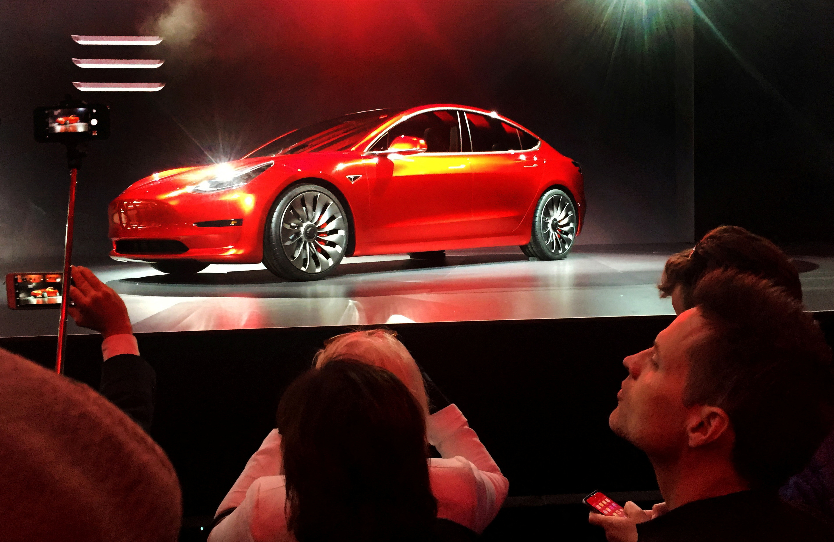 A Tesla Model 3 sedan is displayed during its launch in Hawthorne