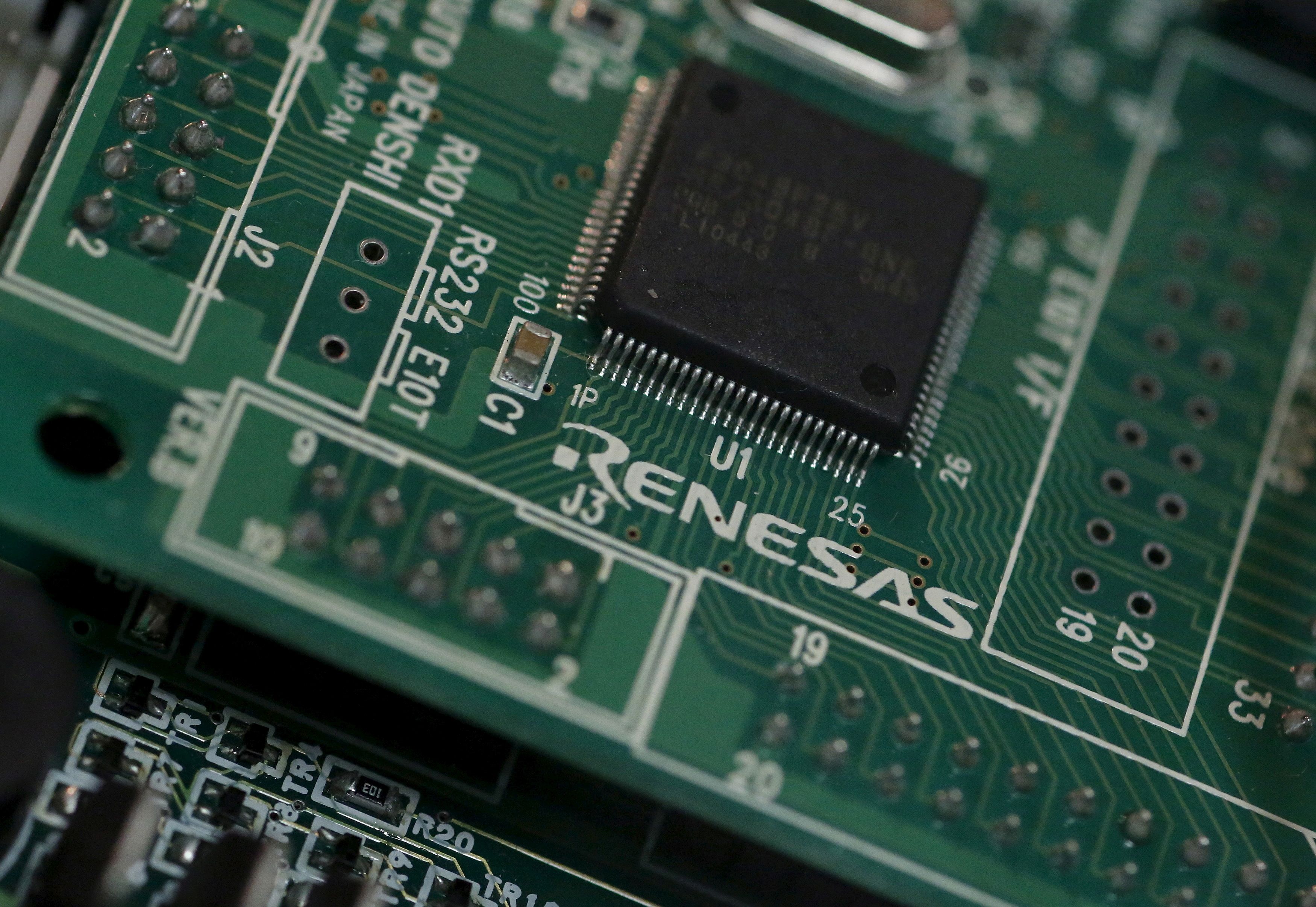 A Renesas Electronics Corp's chip is pictured at the company's office in Tokyo