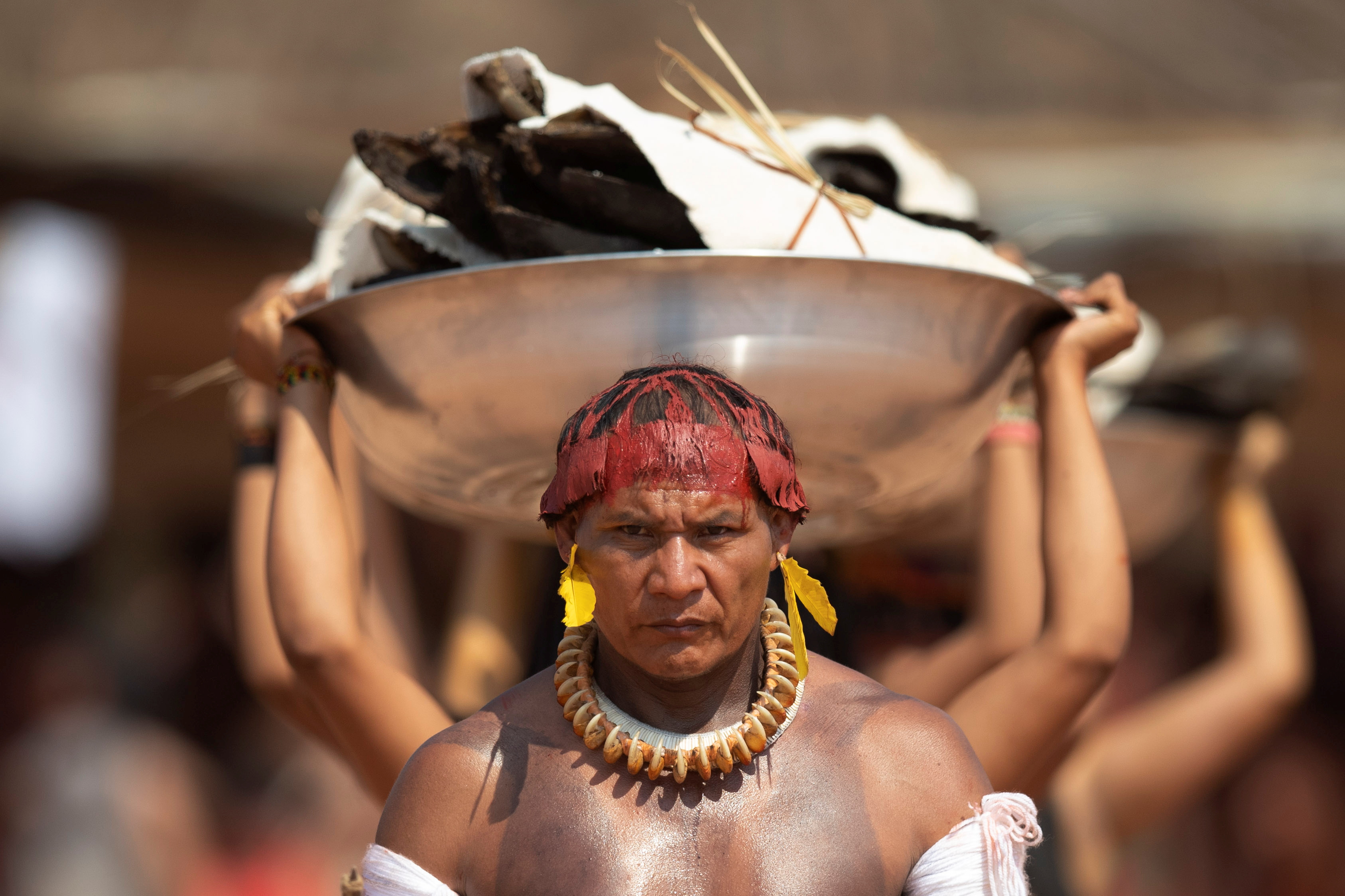 The Wider Image: Rare access captures dances and feasts of Amazonian chief's funeral ritual