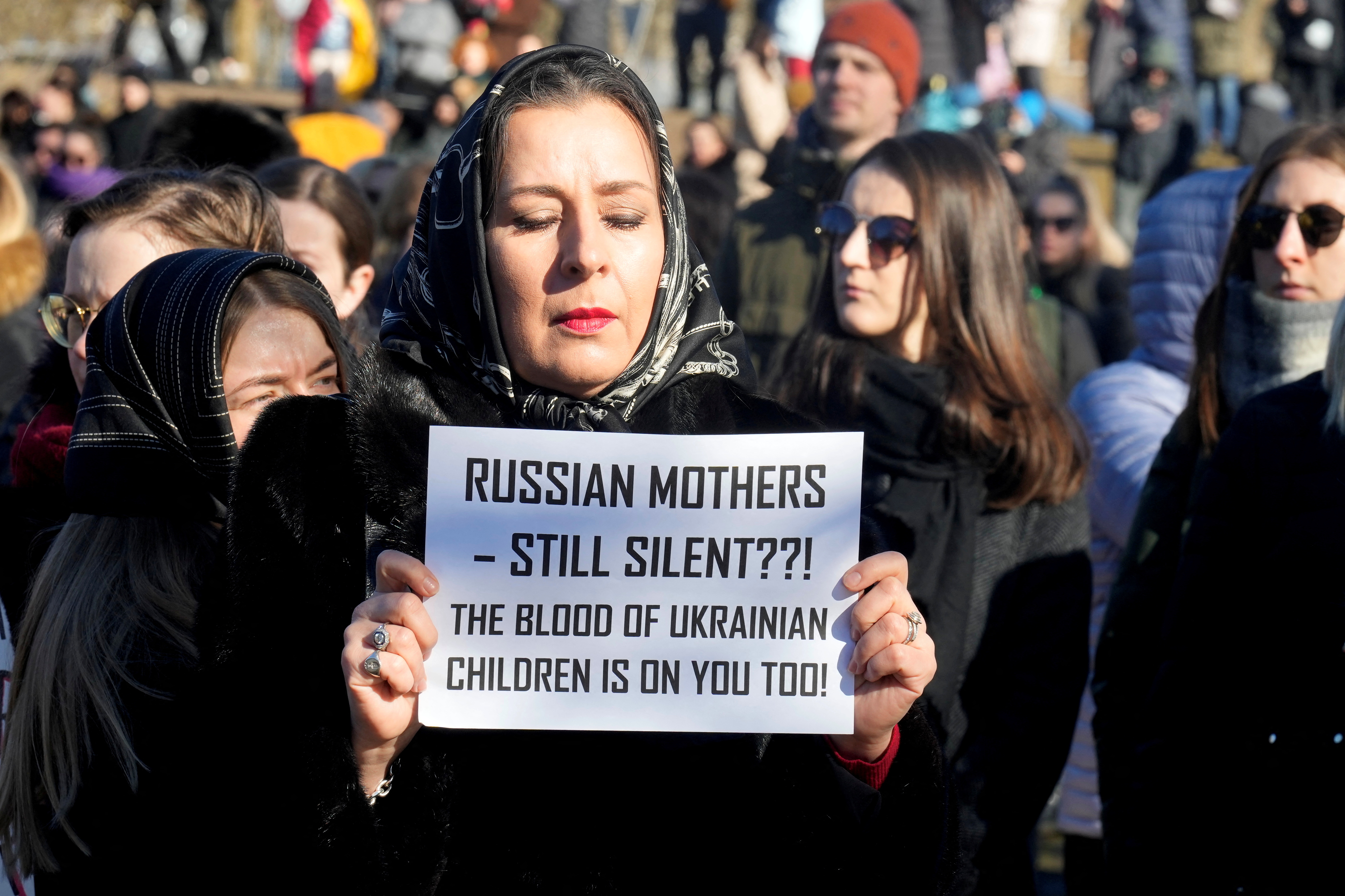 People attend women's protest in front of the Russian embassy in Vilnius
