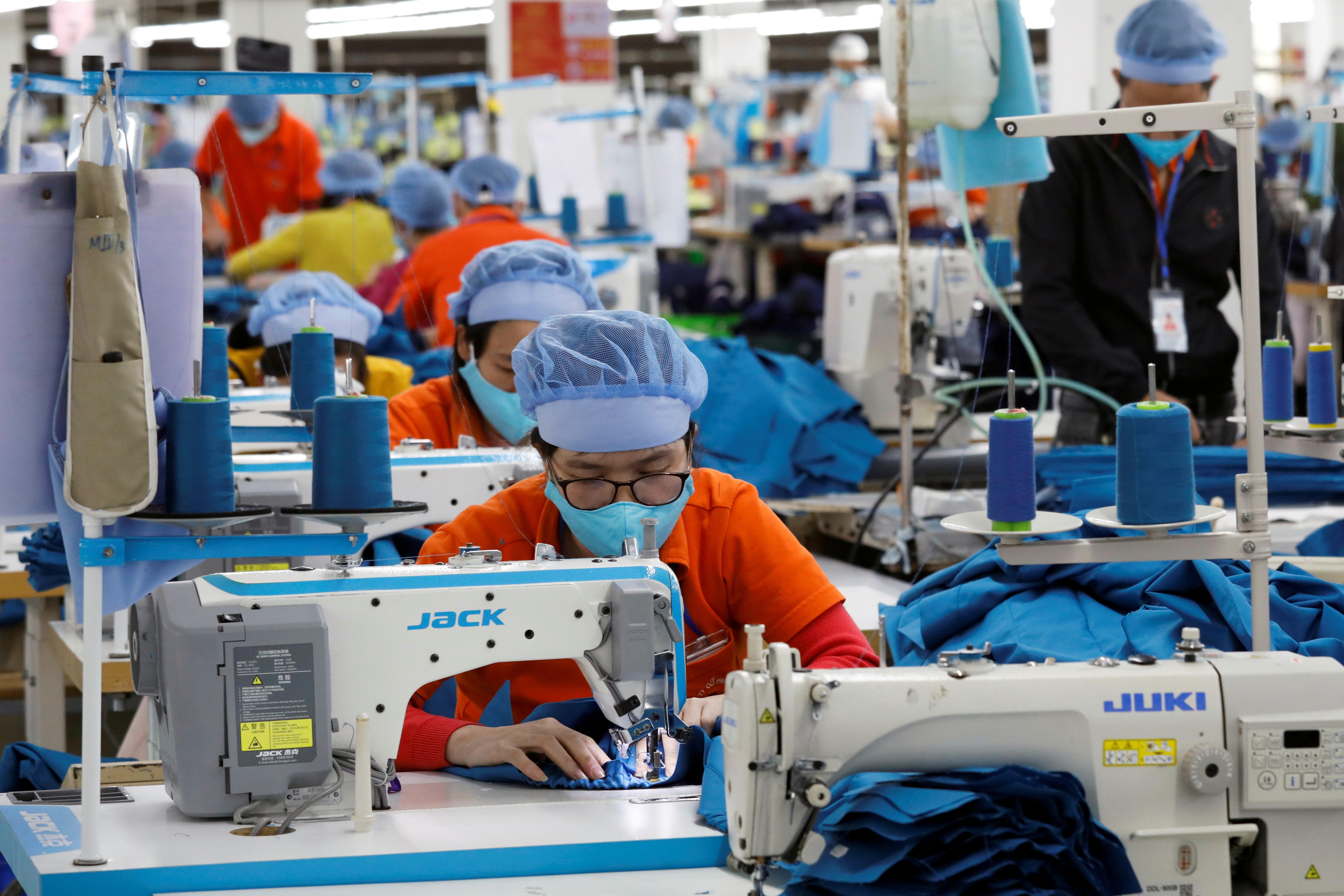 Labourers work at Hung Viet garment export factory in Hung Yen province, Vietnam December 30, 2020. REUTERS/Kham