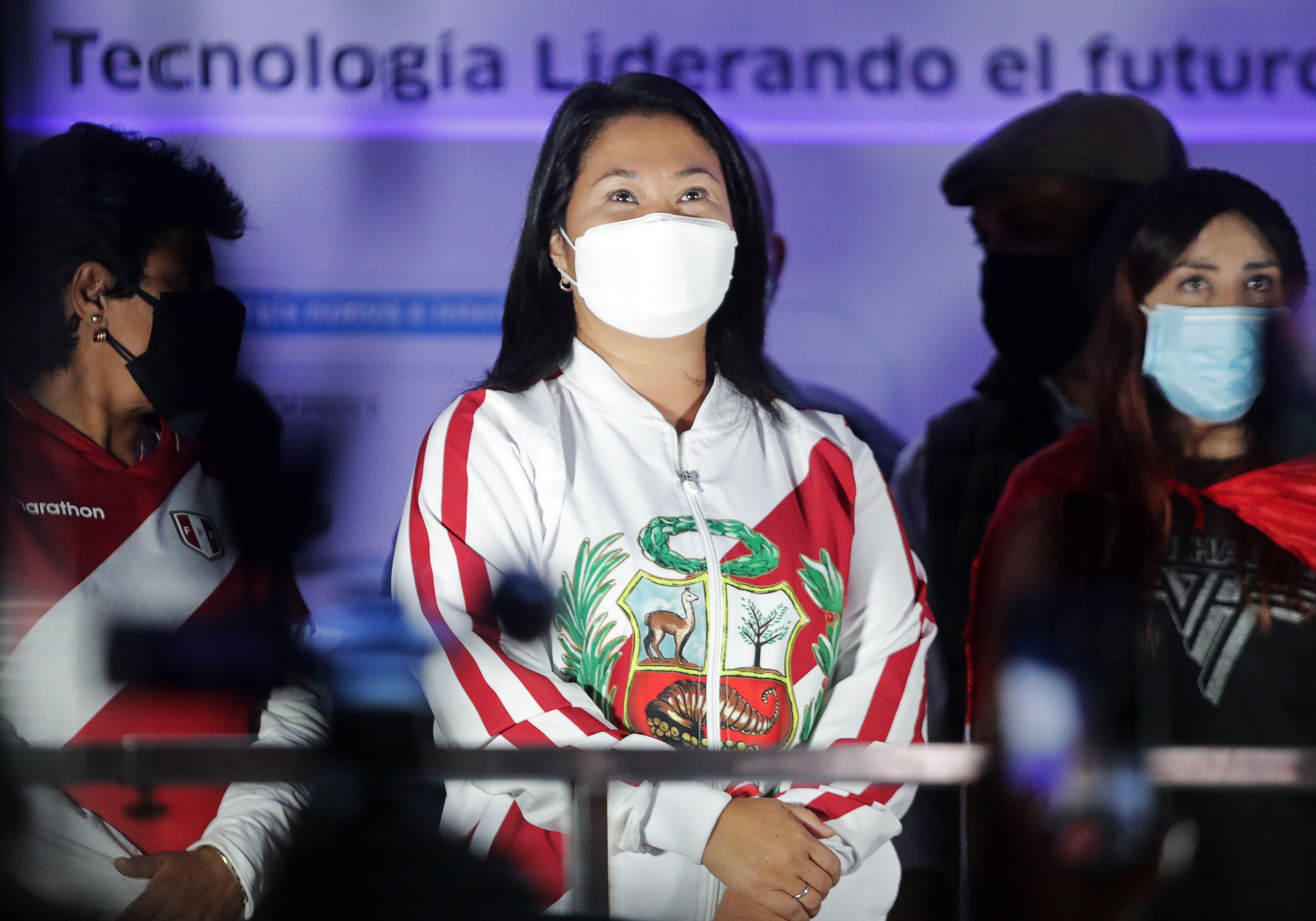 Peru's presidential candidate Keiko Fujimori looks at supporters while leading a demonstration in Lima