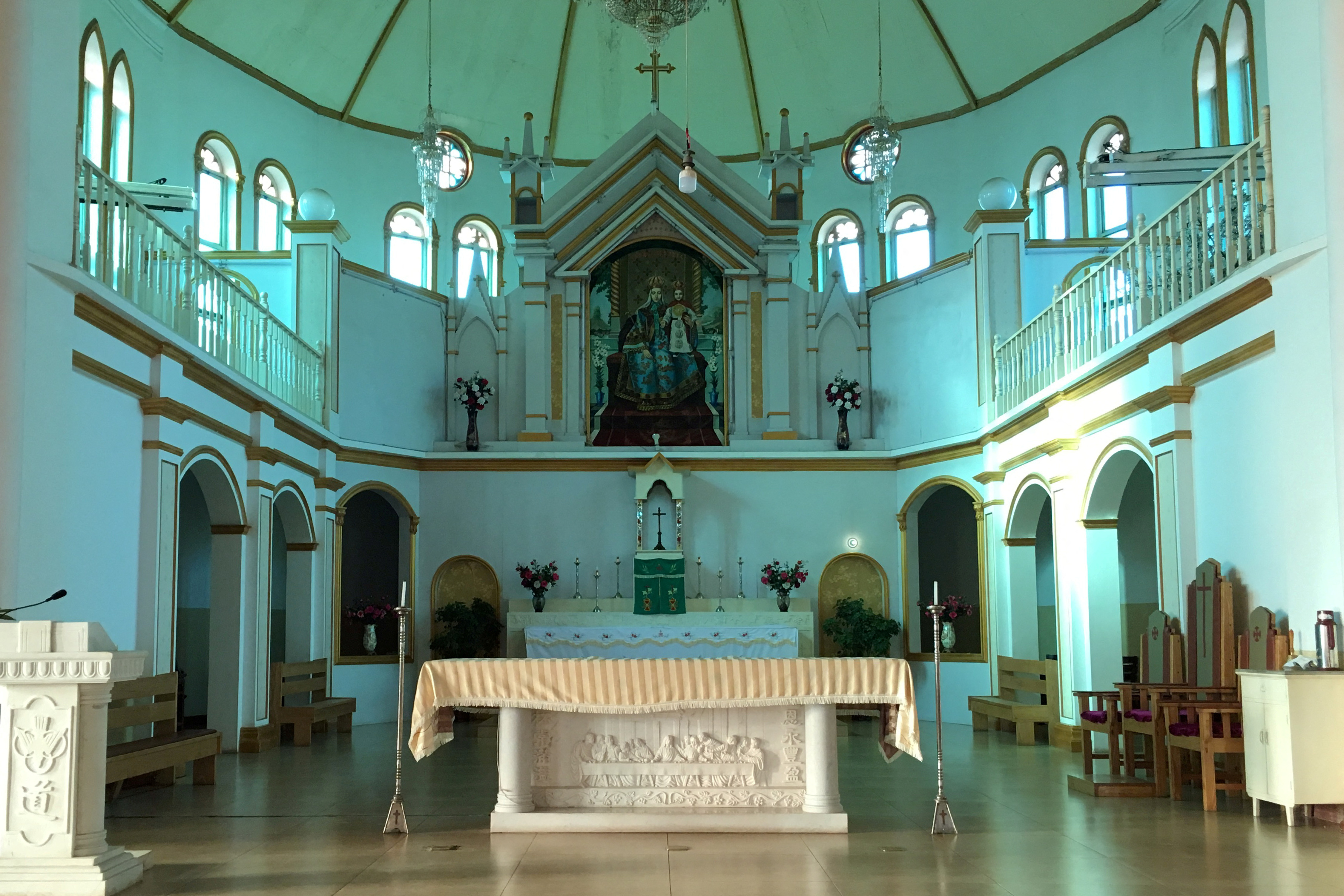 The altar and a painting of the Virgin Mary, known locally as Our Lady of China, are seen at Our Lady of China Catholic Church in Donglu village