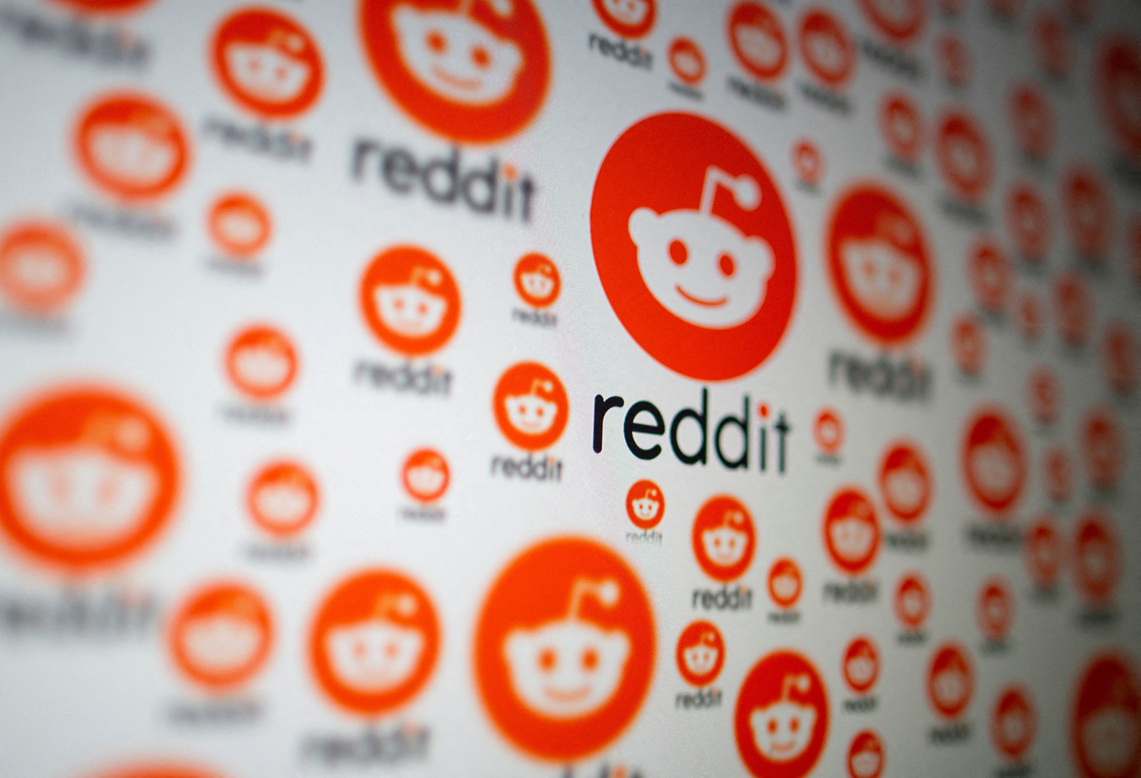 Reddit logos are seen displayed in this illustration