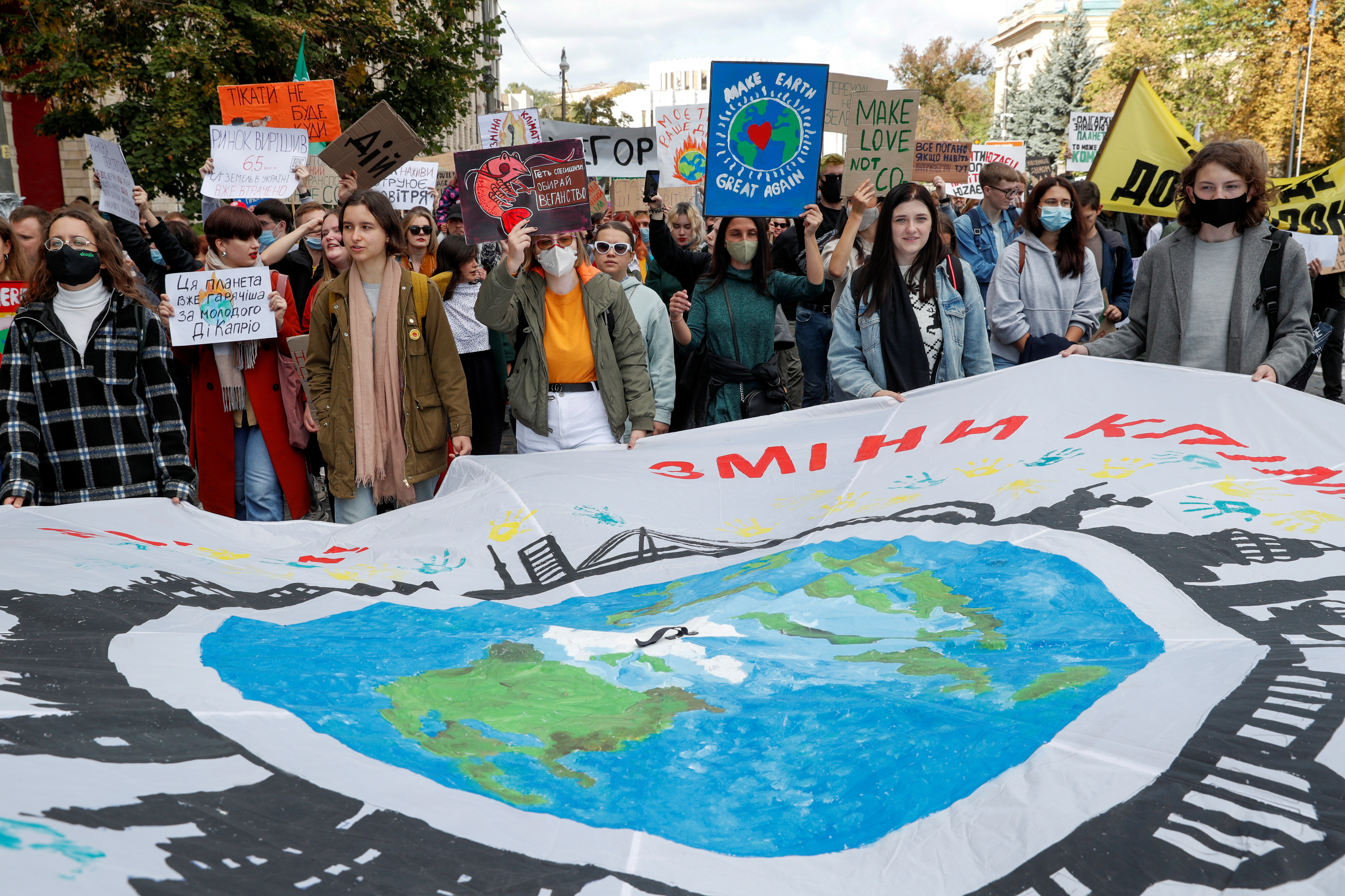 Environmental activists hold a rally demanding actions against climate change in Kyiv