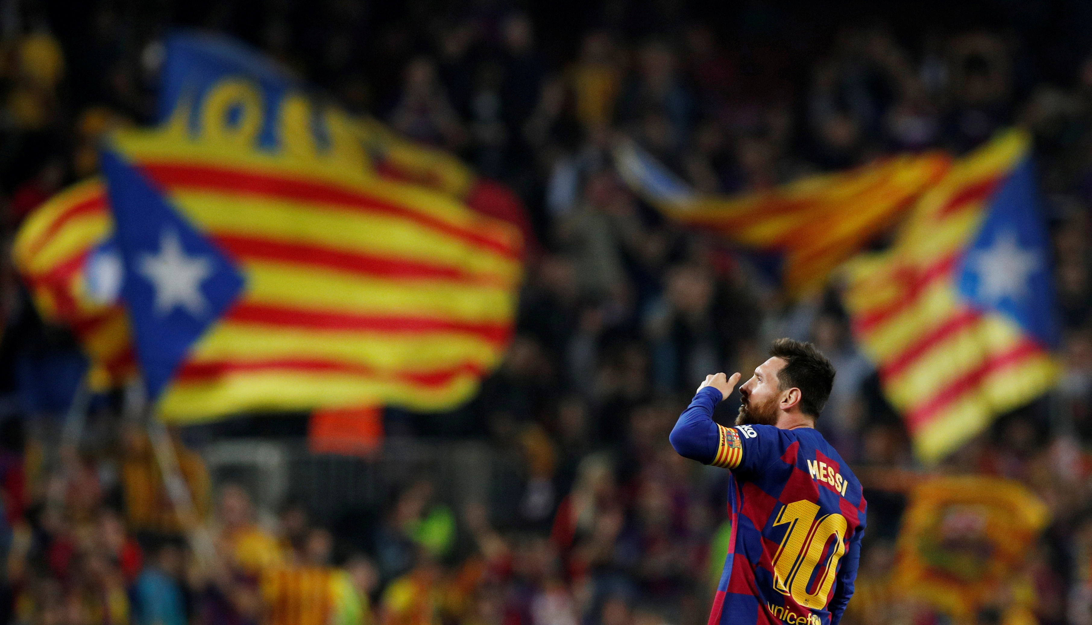 Barcelona's Lionel Messi celebrates scoring their third goal