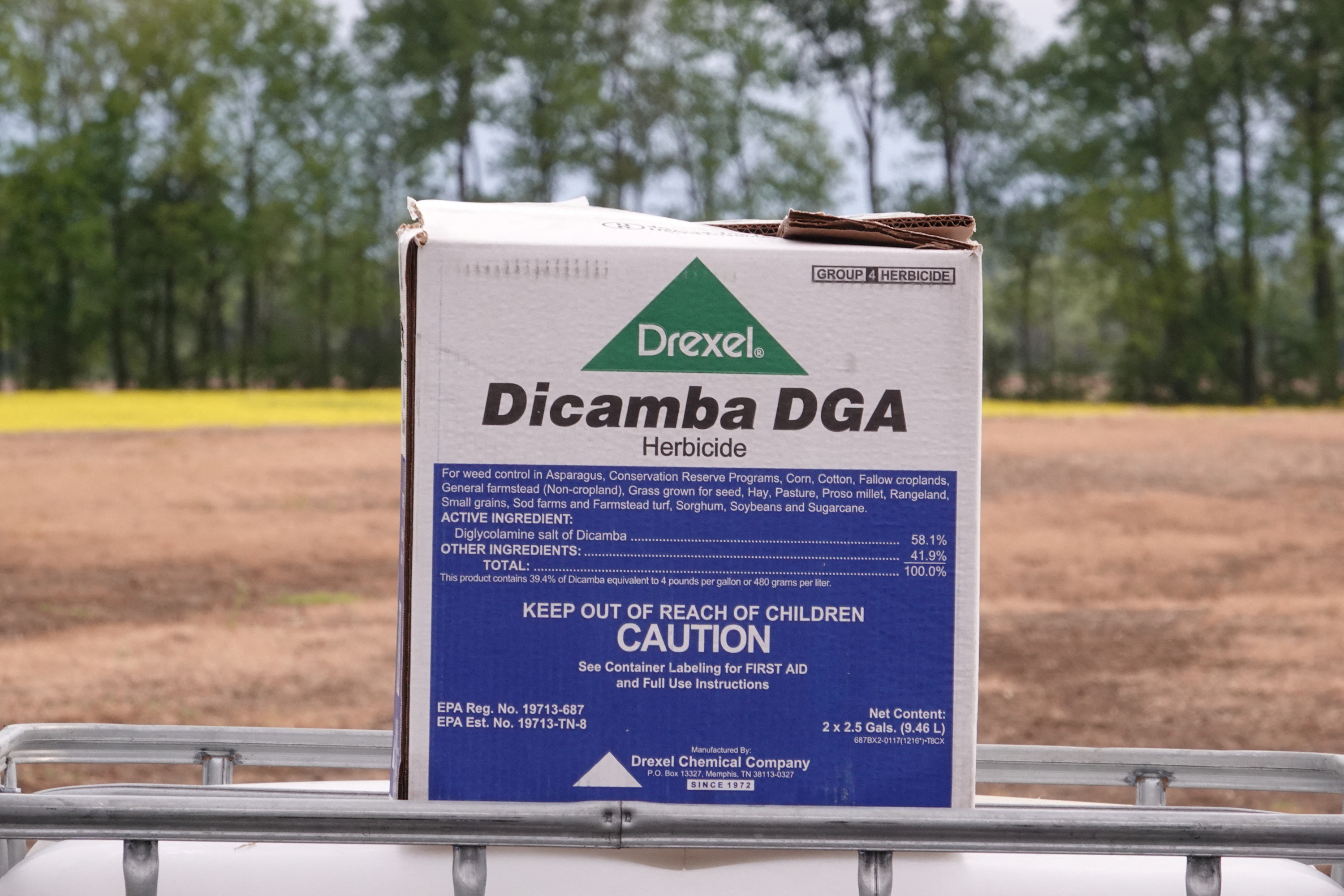 A box of Drexel herbicide Dicamba DGA lies on a truck bed at a farm in Ridgely