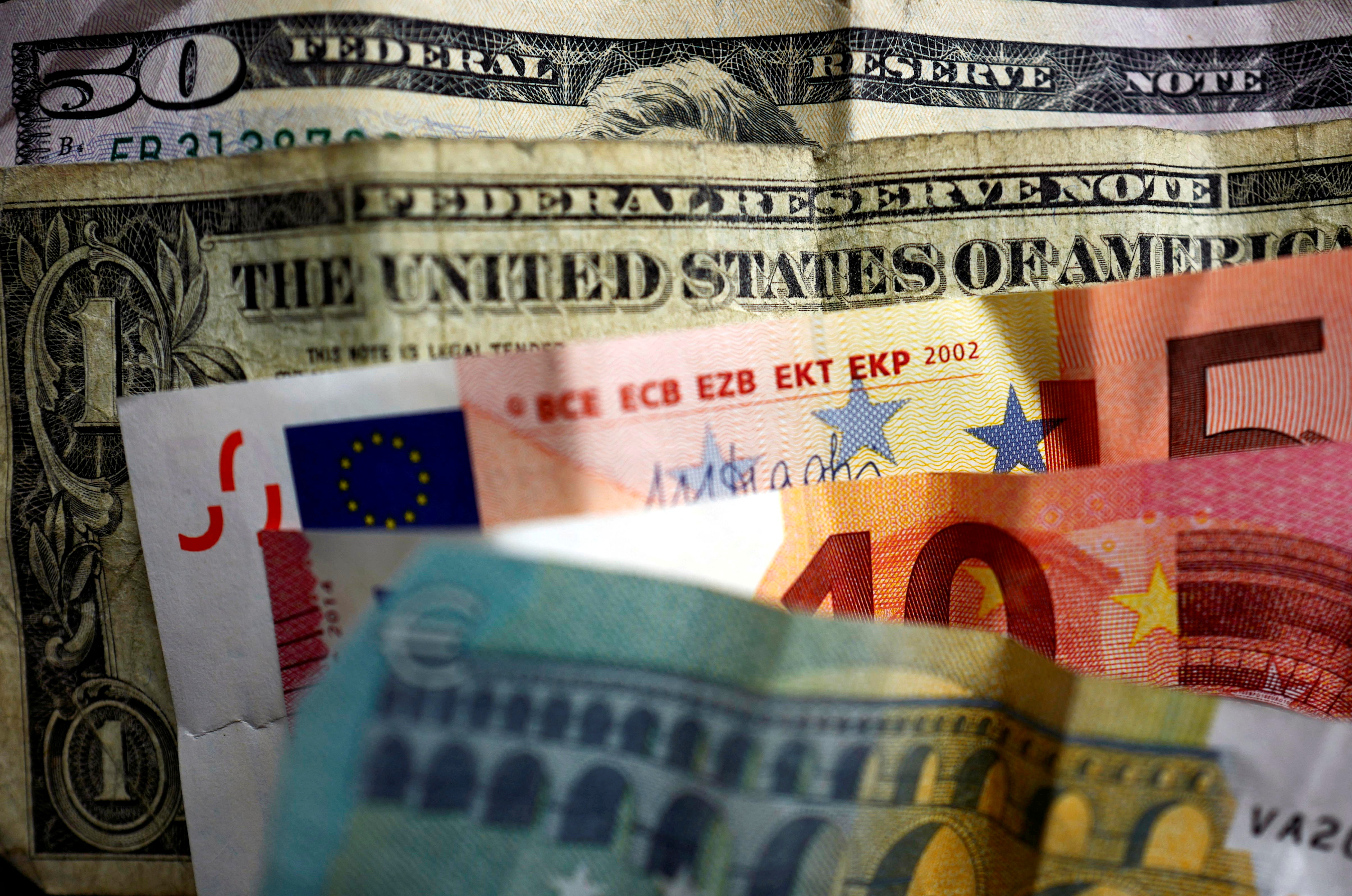 U.S. dollar and Euro bank notes are photographed in Frankfurt, Germany, in this illustration picture