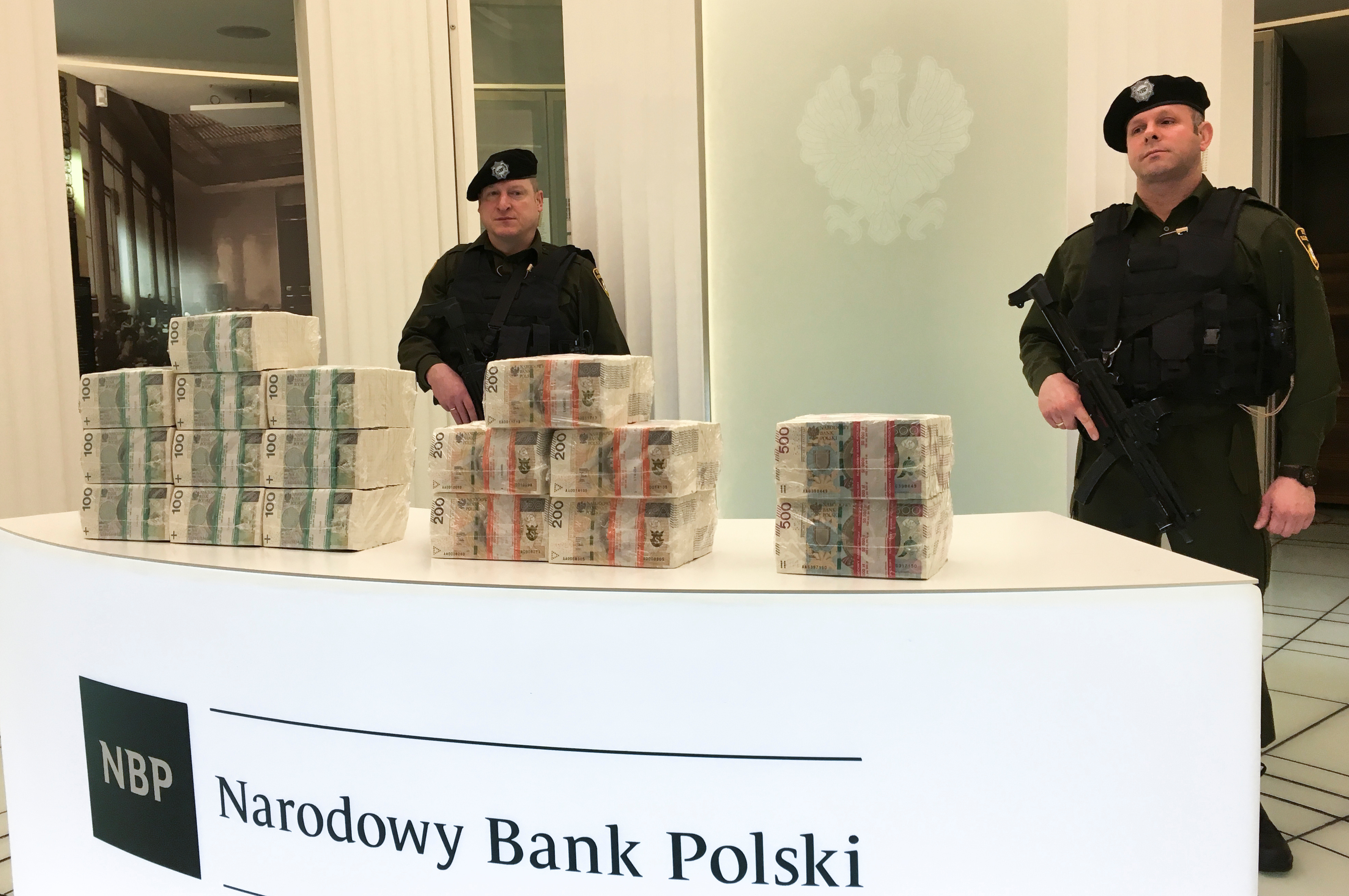 Security men at the Polish central bank headquarters guard piles of cash worth 1 million zlotys