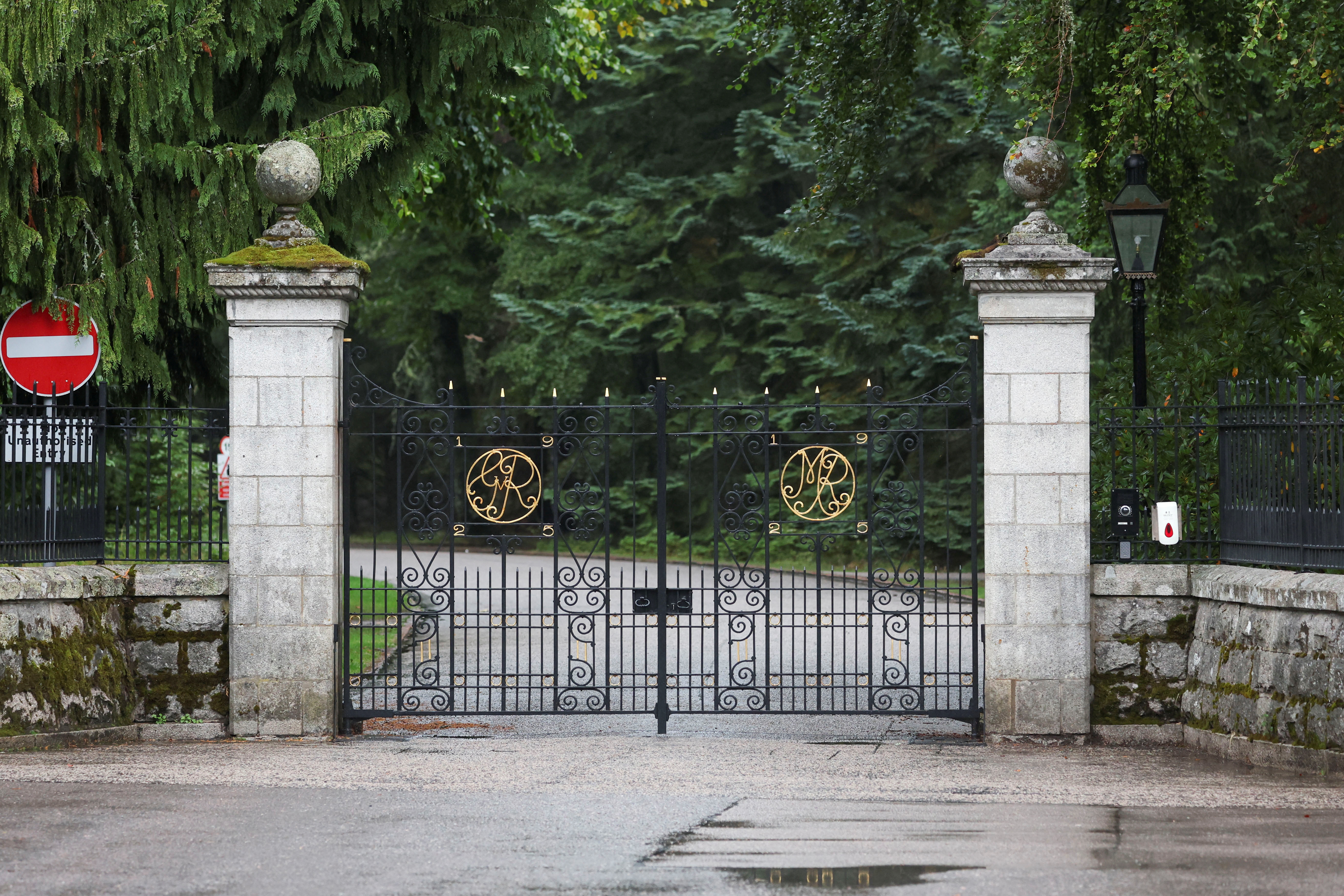 Police officers guard the gates of Balmoral Castle in Balmoral