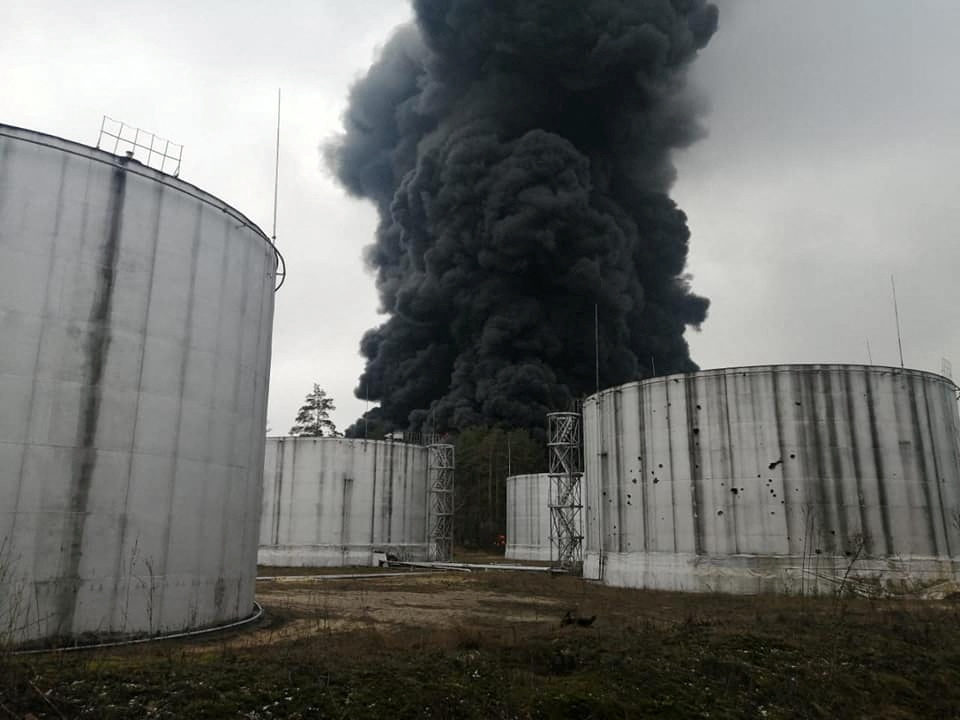 Smoke rises from the oil depot, which, according to local authorities, was damaged by shelling in Chernihiv