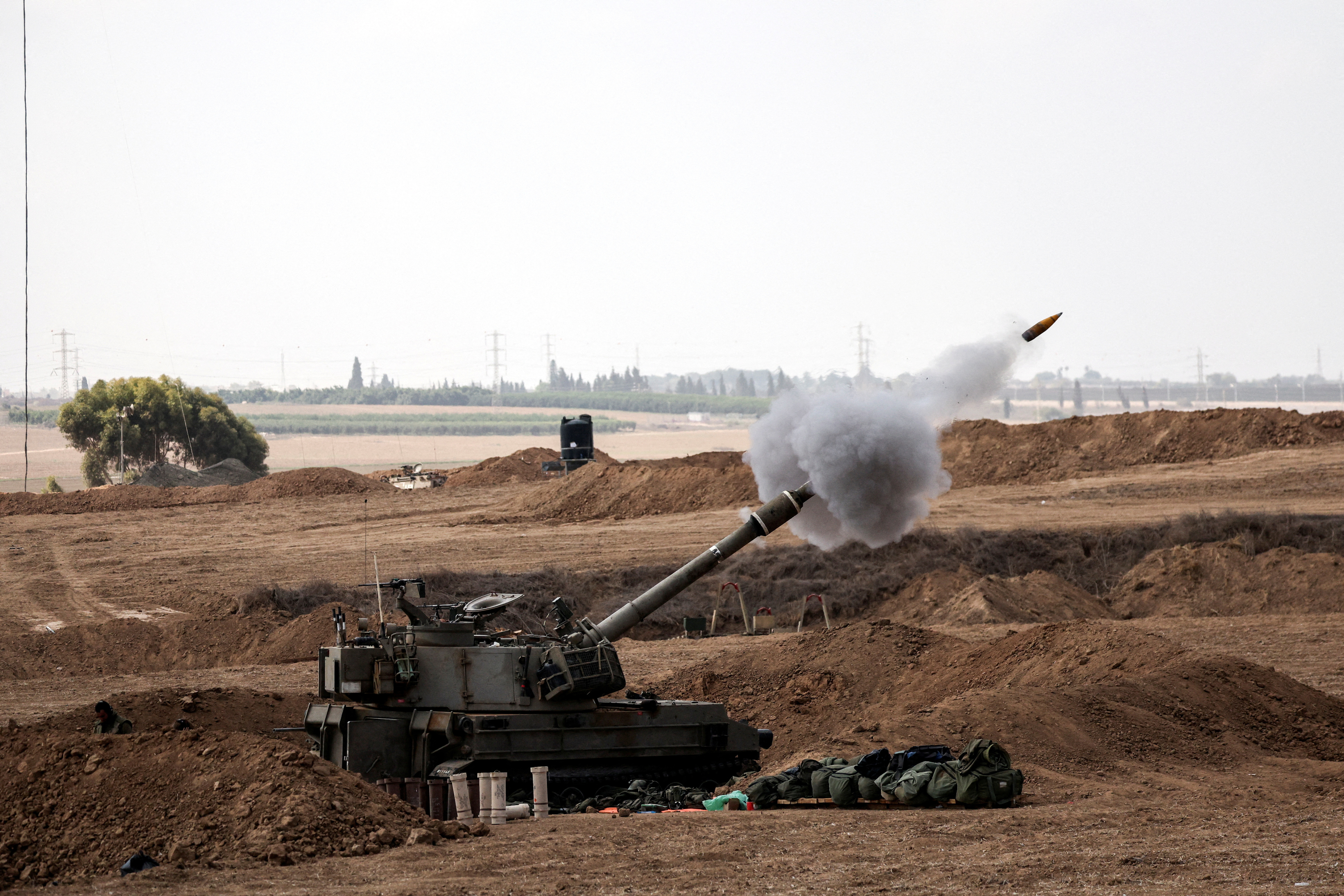 Israeli artillery fires near Israel's border with the Gaza Strip, in southern Israel