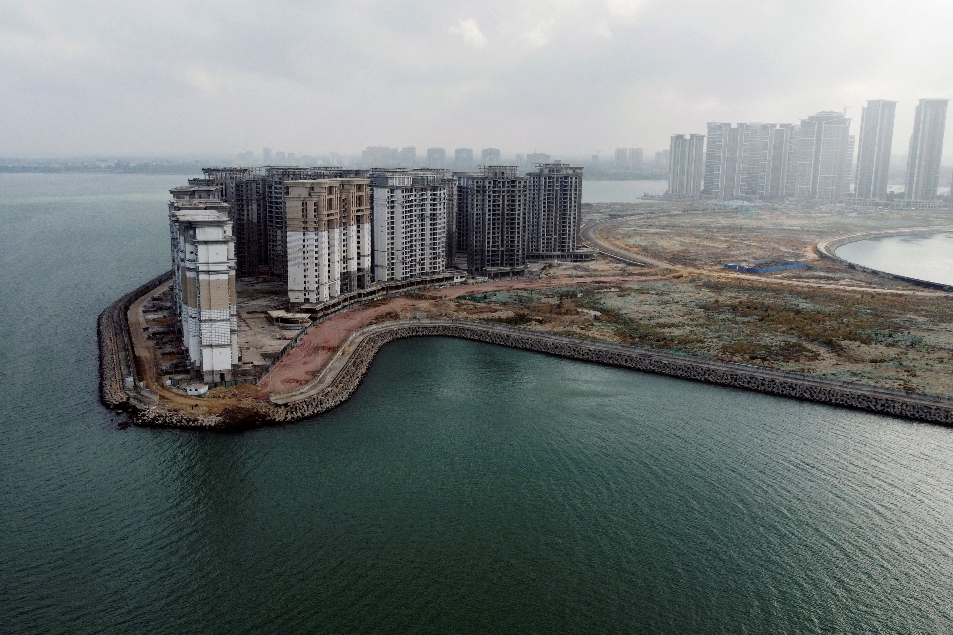 Authorities turn seized home towers at Evergrande's resort island to