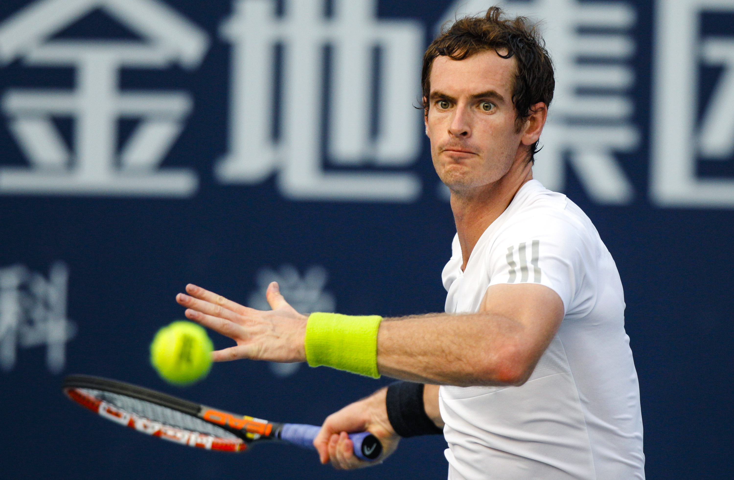 Murray of Britain hits a return to Robredo of Spain during their men's singles final match at the Shenzhen Open tennis tournament in Shenzhen
