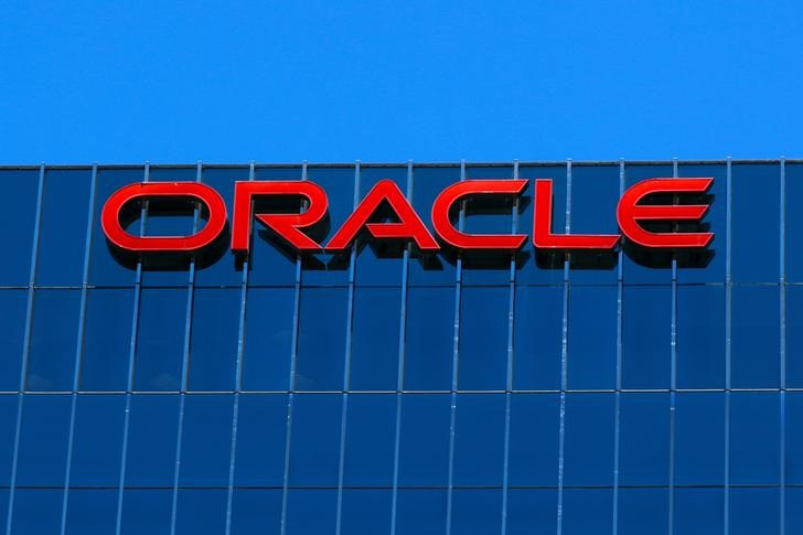 The Oracle logo is shown on an office building in Irvine, California