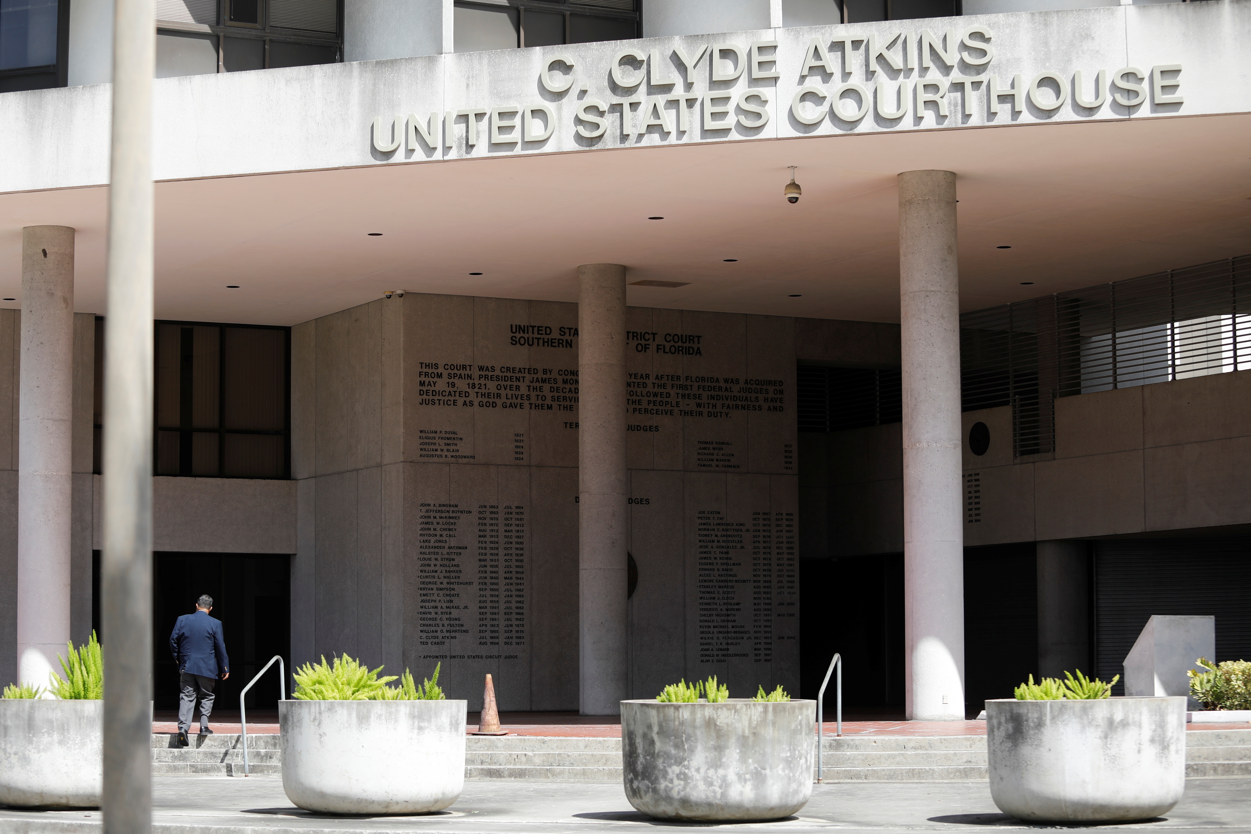 A man walks in C. Clyde Atkins U.S. Courthouse where Alex Saab, a businessman accused of laundering money on behalf of Venezuela's government, will be arraigned in Florida federal court in Downtown Miami, Florida, U.S., October 18, 2021. REUTERS/Marco Bello