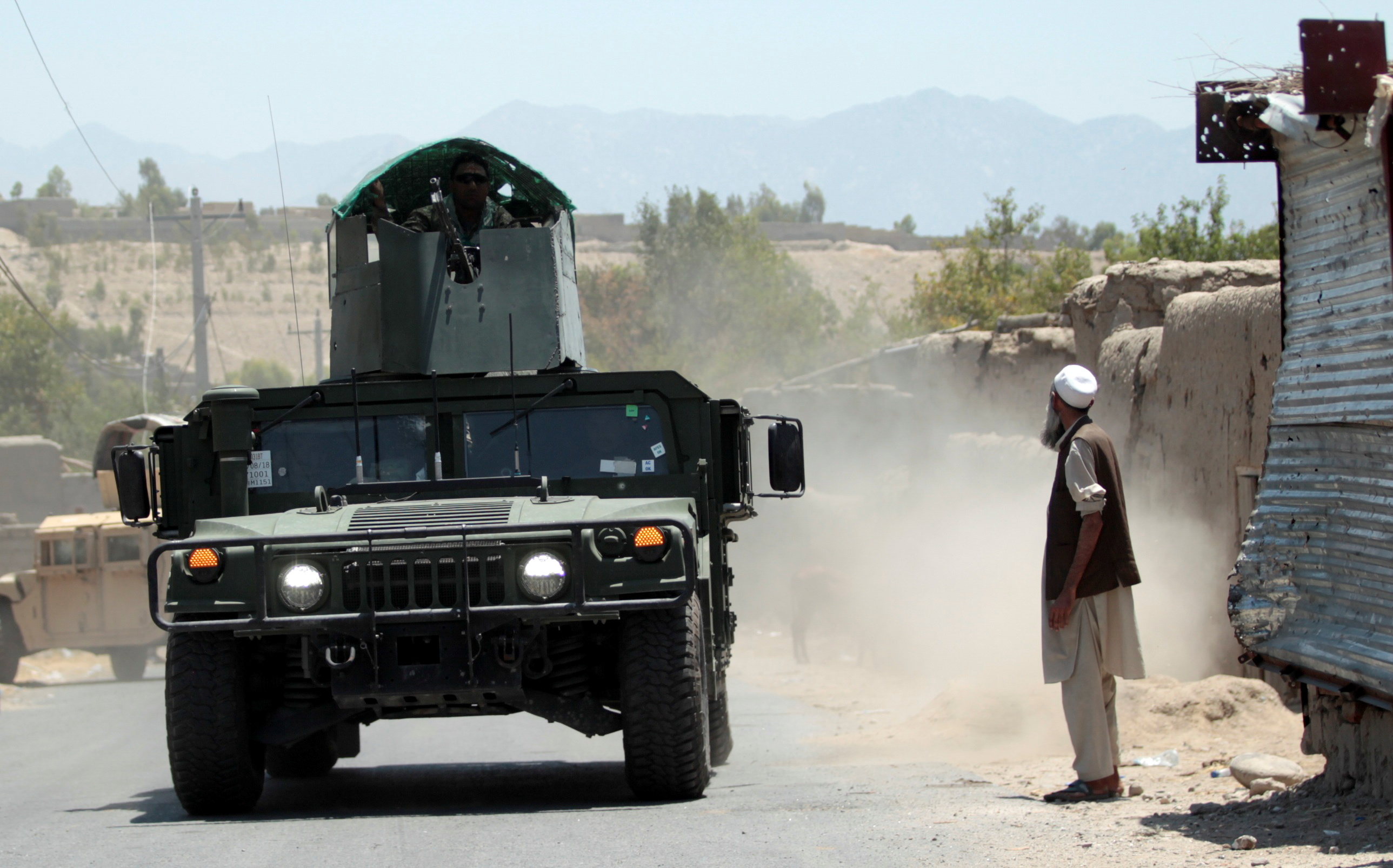 Afghan soldiers recapture checkpoint from the Taliban, in Alishing district of Laghman province