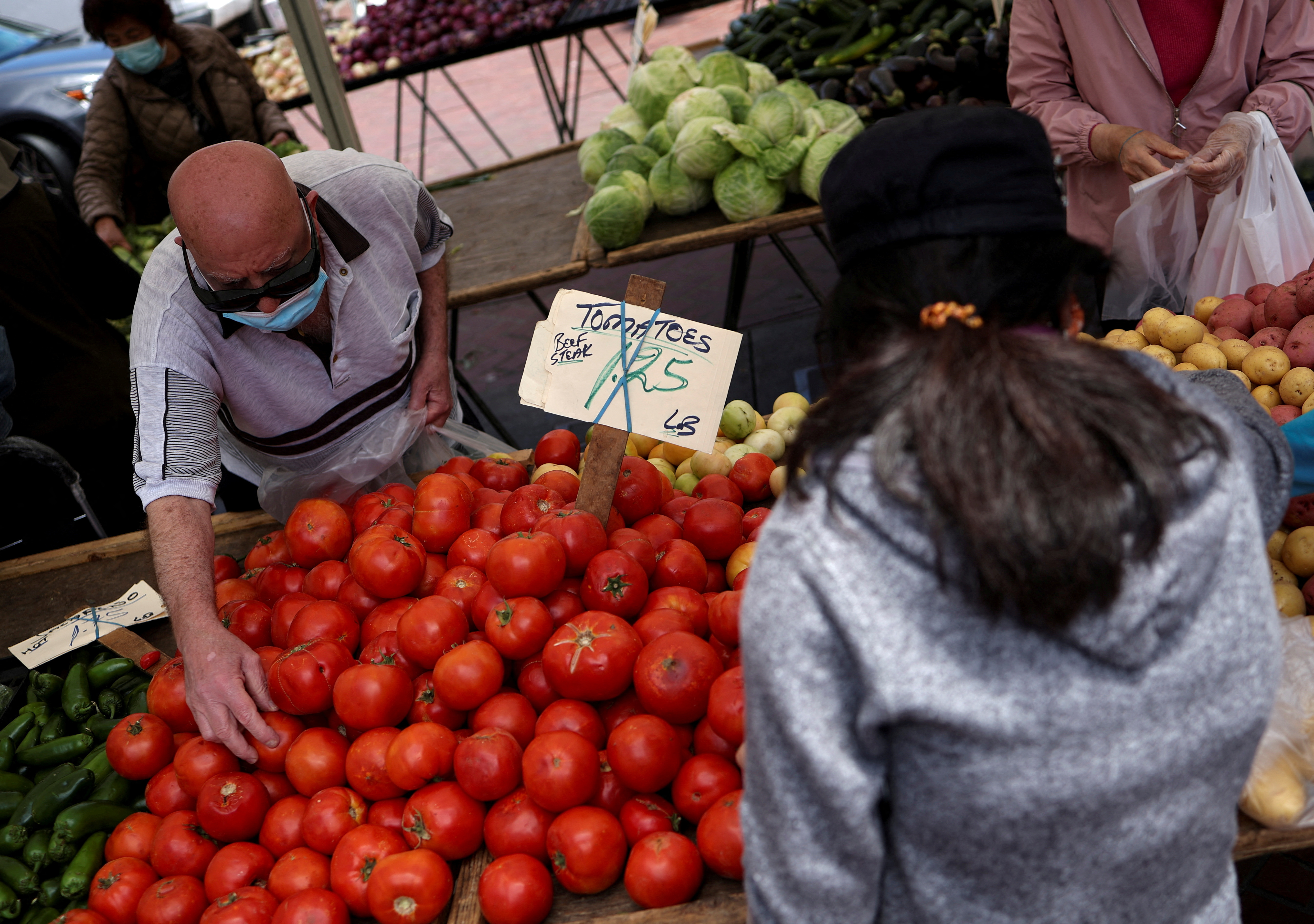Residents buy food at a local market, in downtown San Francisco, California