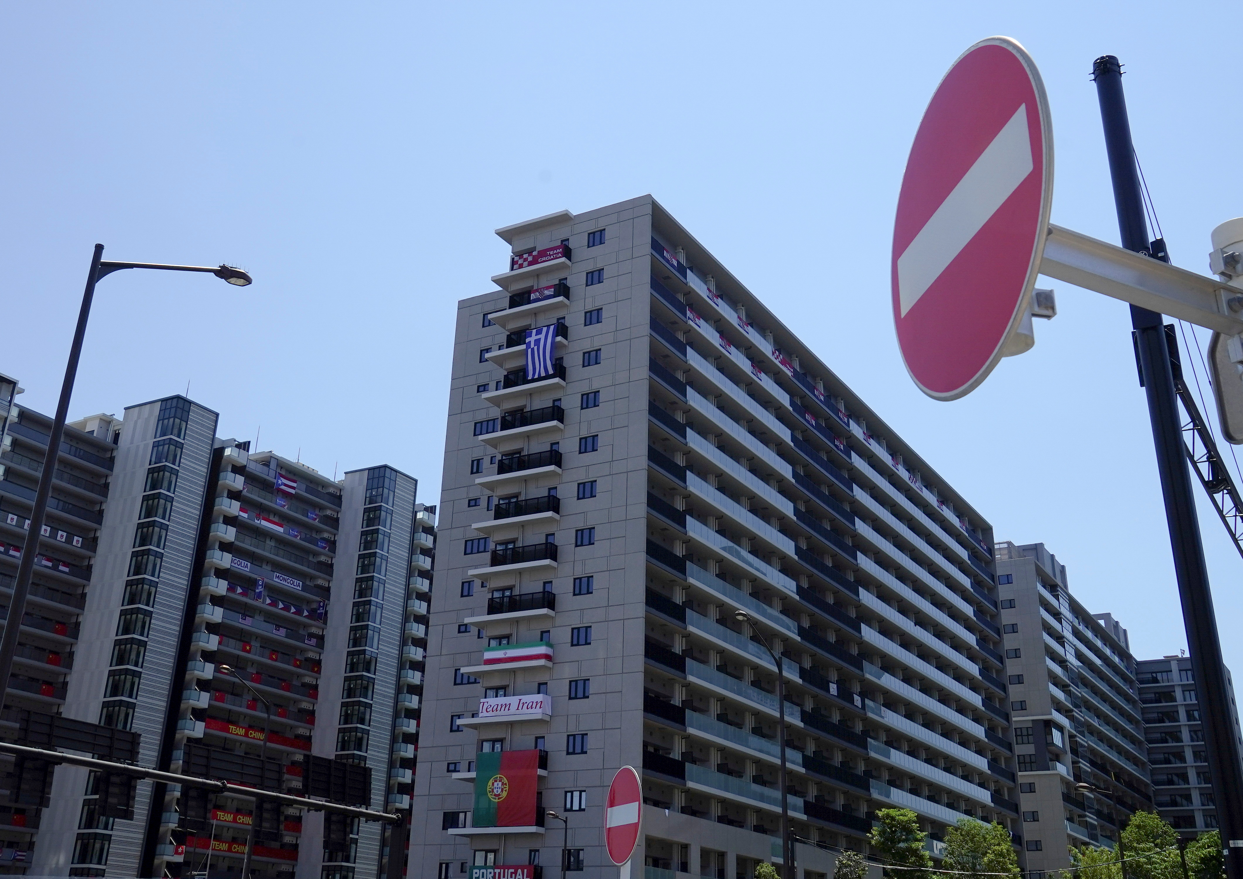 Traffic signs are seen at the athletes' village for the Tokyo 2020 Olympic Games, in Tokyo, Japan, July 22, 2021. REUTERS/Naoki Ogura REFILE - QUALITY REPEAT