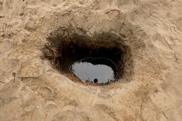 An illegally-dug oil well is seen at Ilashe in Lagos