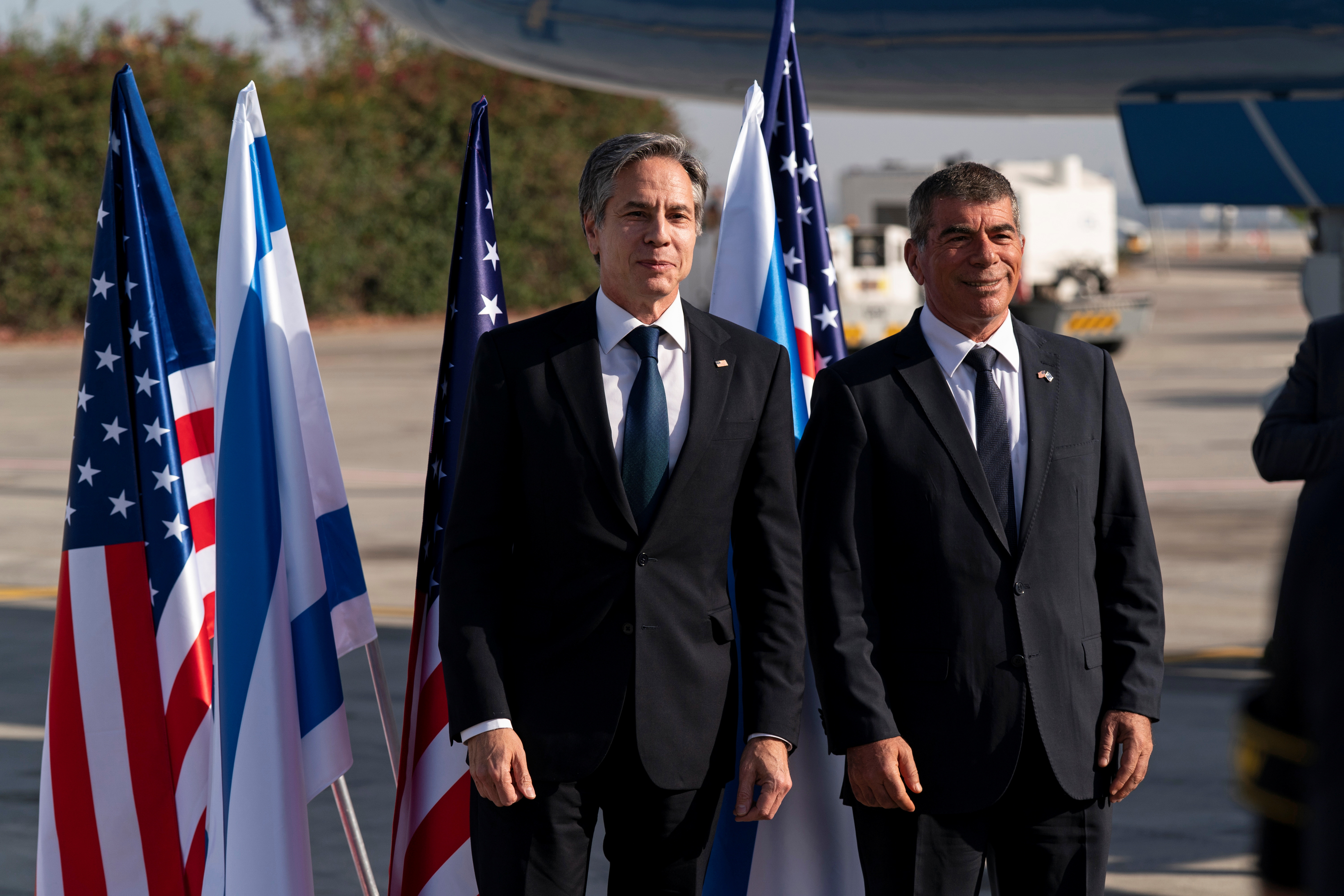 U.S. Secretary of State Antony Blinken talks with Israeli Foreign Minister Gabi Ashkenazi, upon arrival at Tel Aviv Ben Gurion Airport