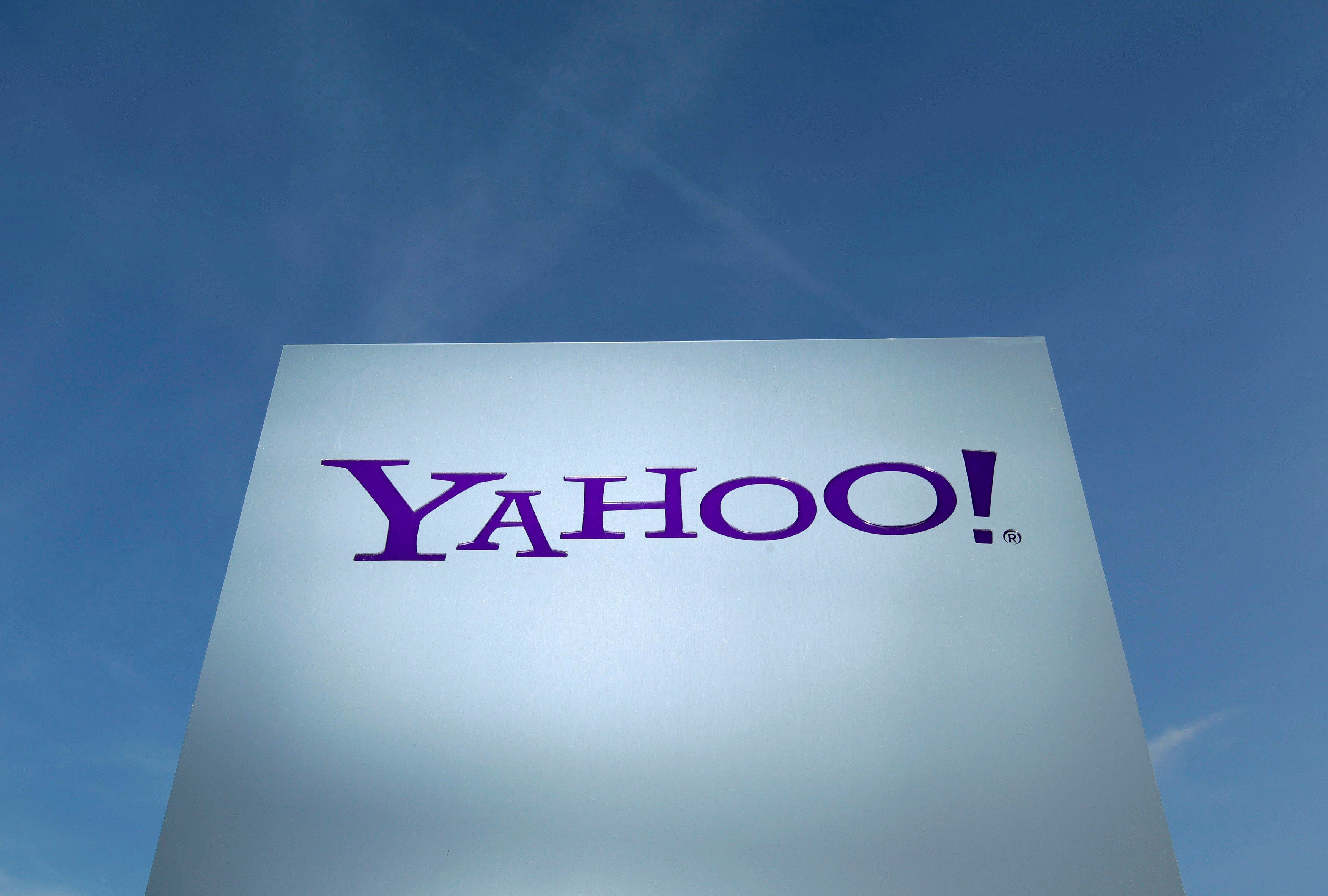 A Yahoo logo is pictured in front of a building in Rolle, Switzerland December 12, 2012.  REUTERS/Denis Balibouse