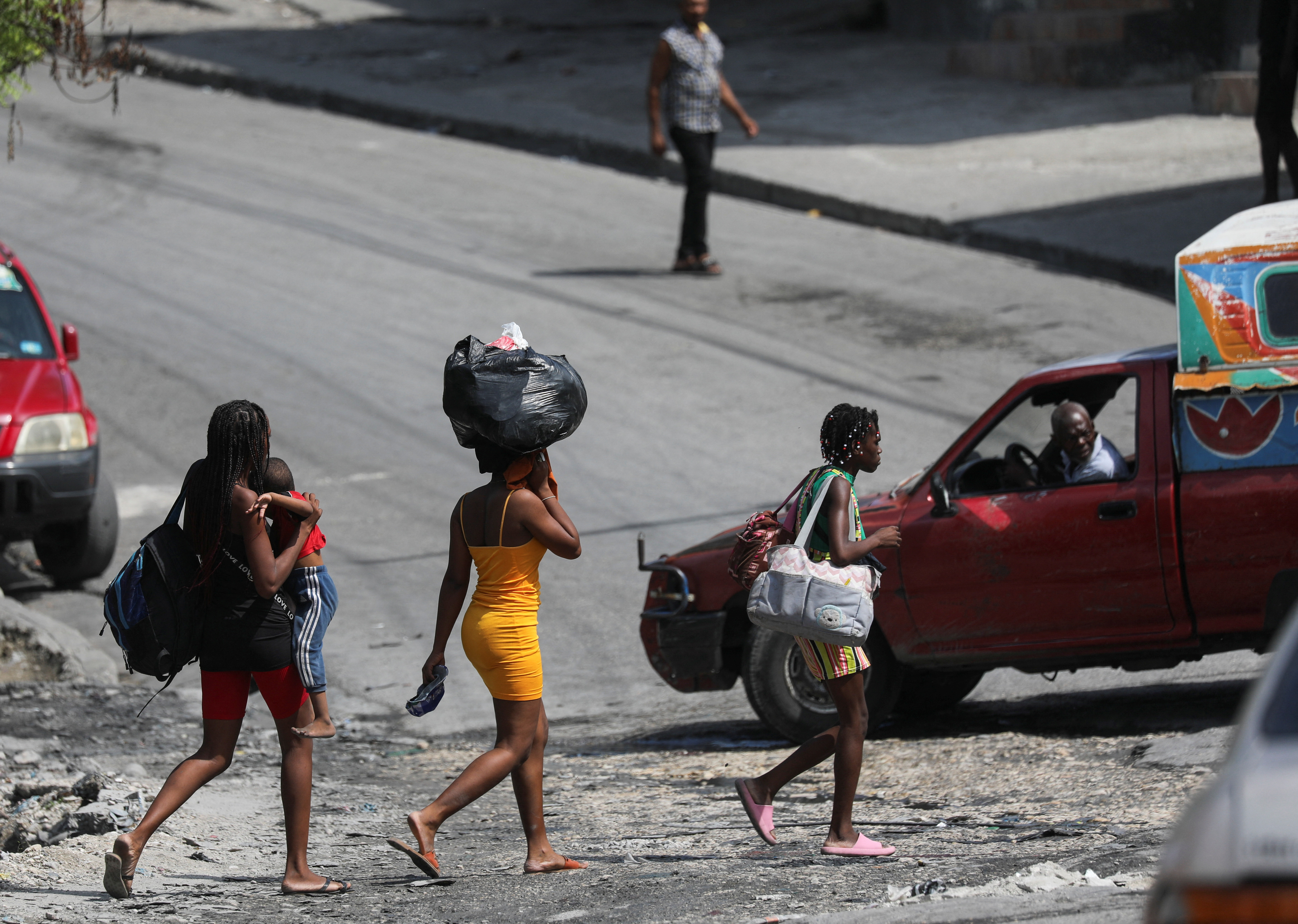 Haitians flee homes from gang violence, in Port-au-Prince