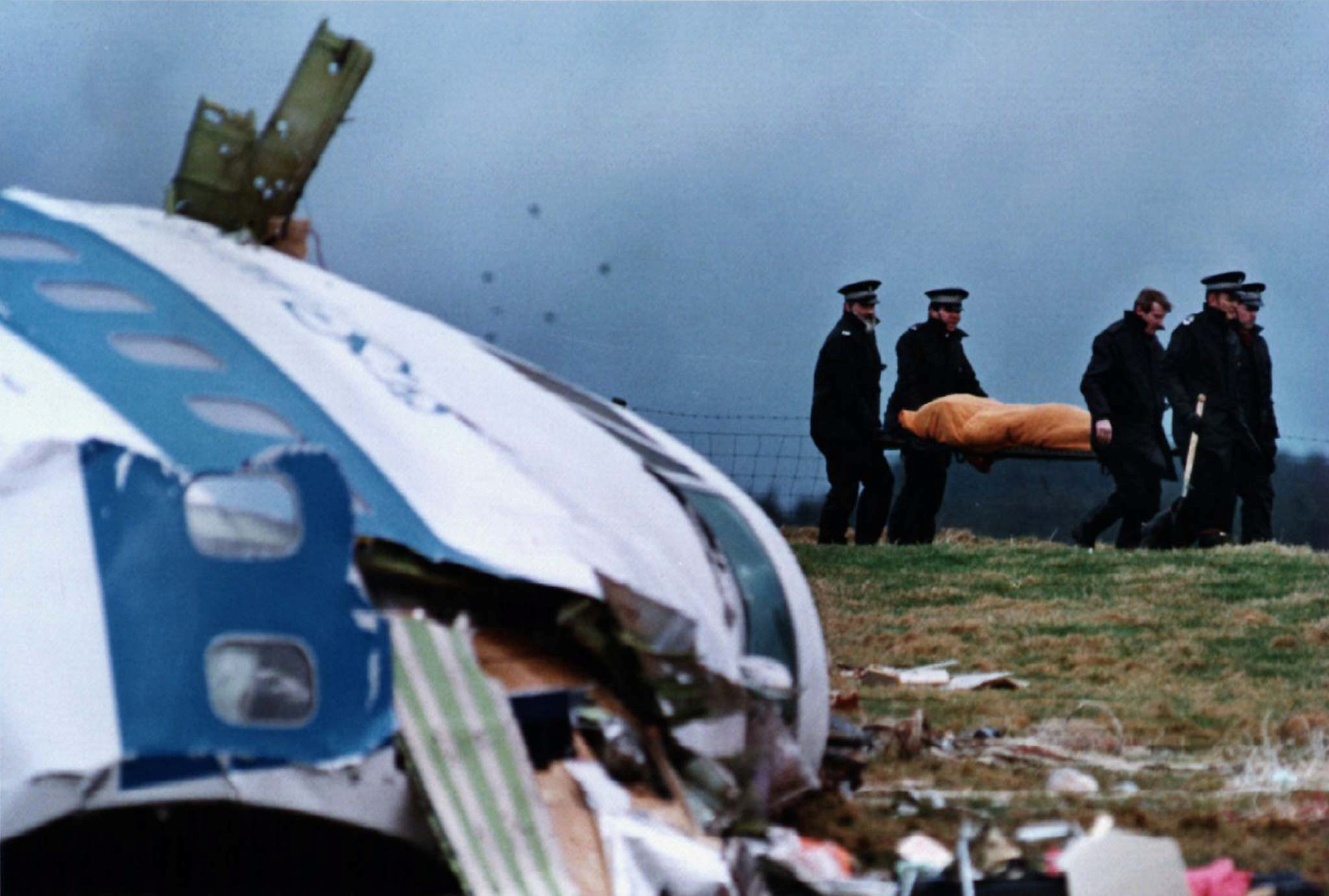 FILE PHOTO SHOWS POLICE STRETCHERING VICTIM FROM LOCKERBIE AIR DISIASTER.