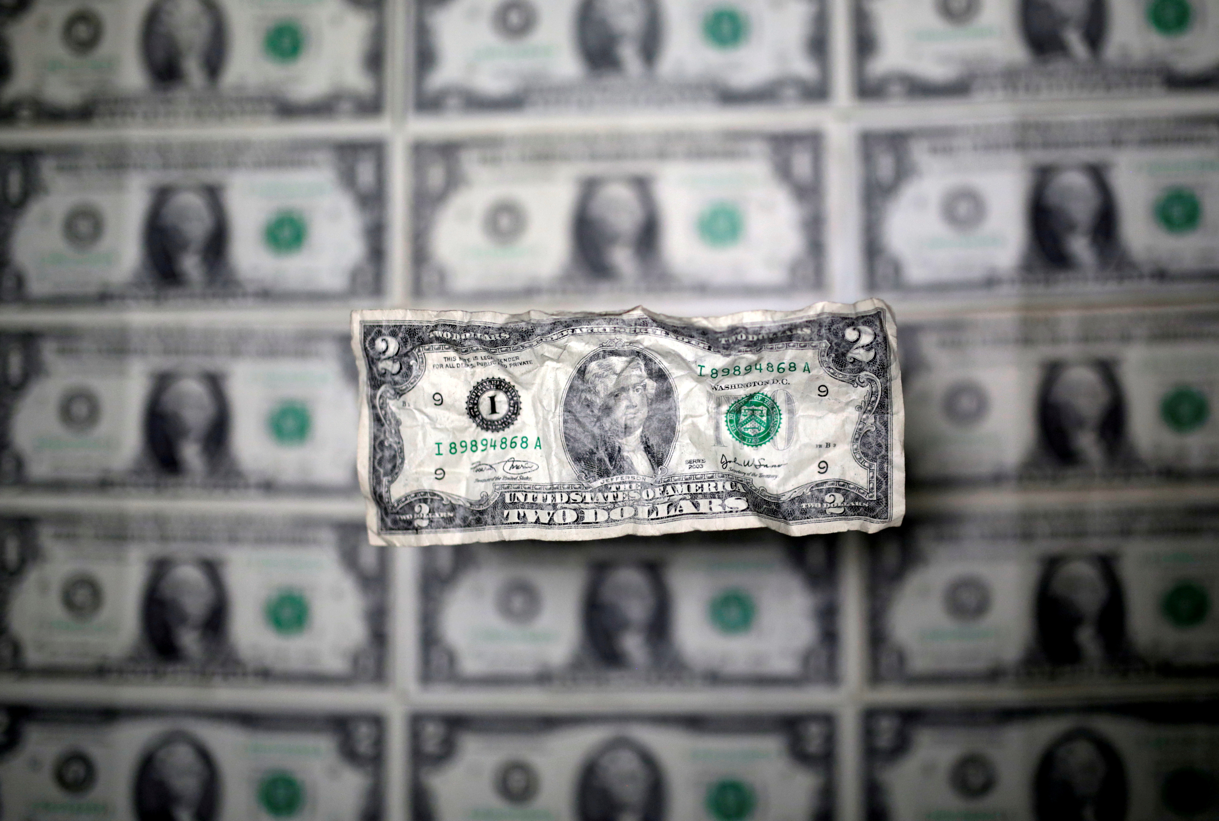 FILE PHOTO: U.S. dollar banknote is seen in this picture illustration