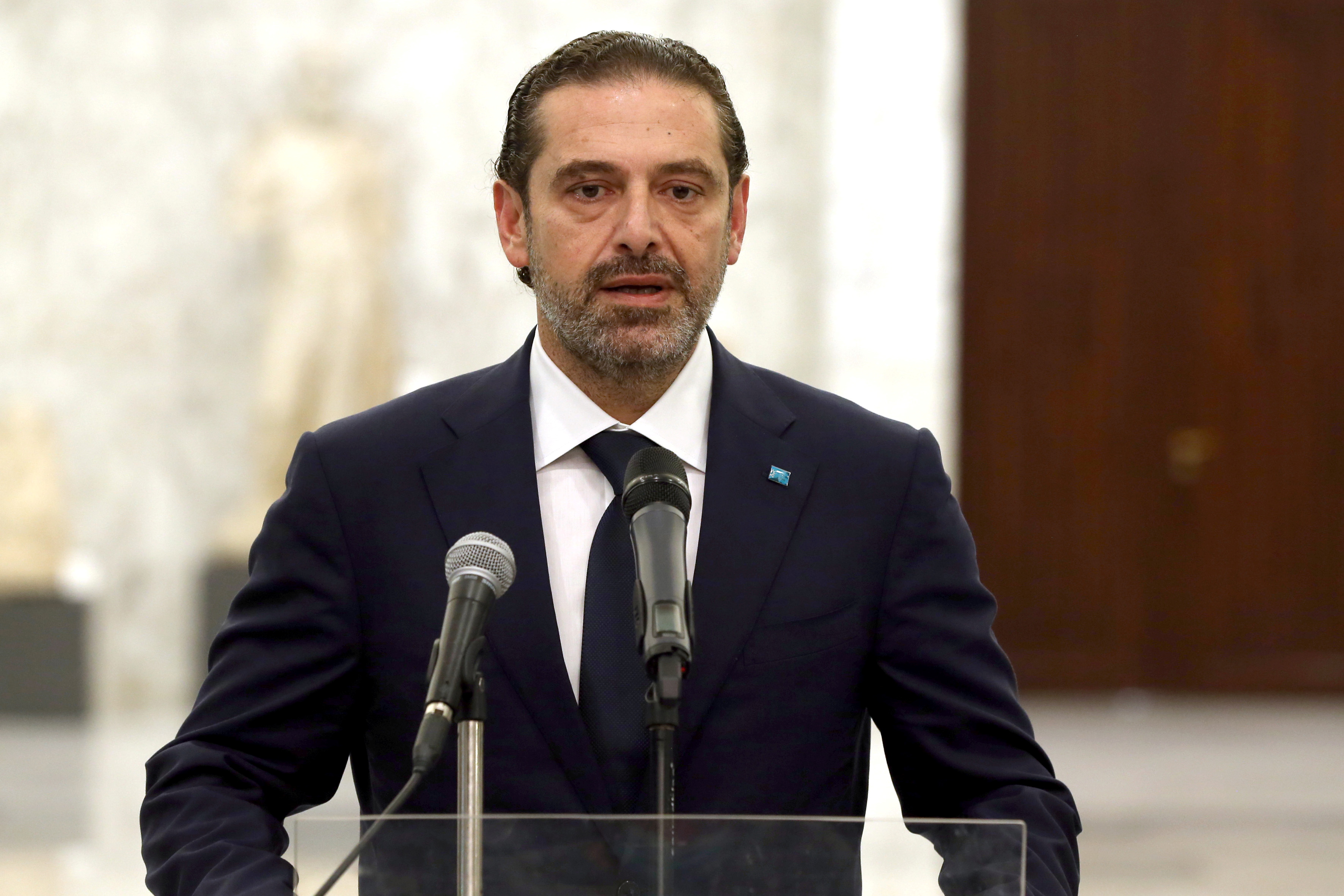 Prime Minister-designate Saad al-Hariri speaks at the presidential palace in Baabda