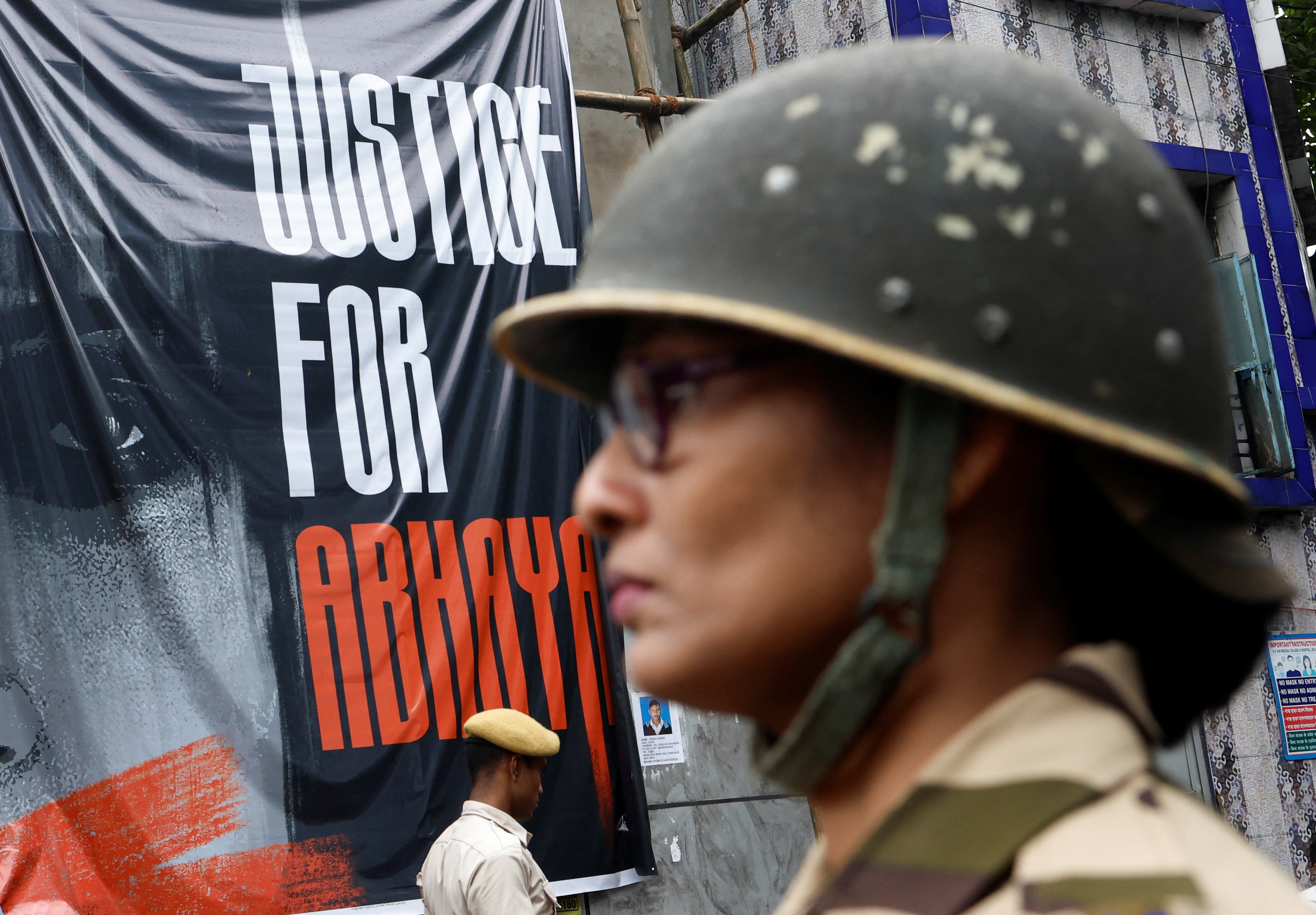 Central Industrial Security Force (CISF) personnel stand guard at the entrance of R G Kar Medical College and Hospital in Kolkata