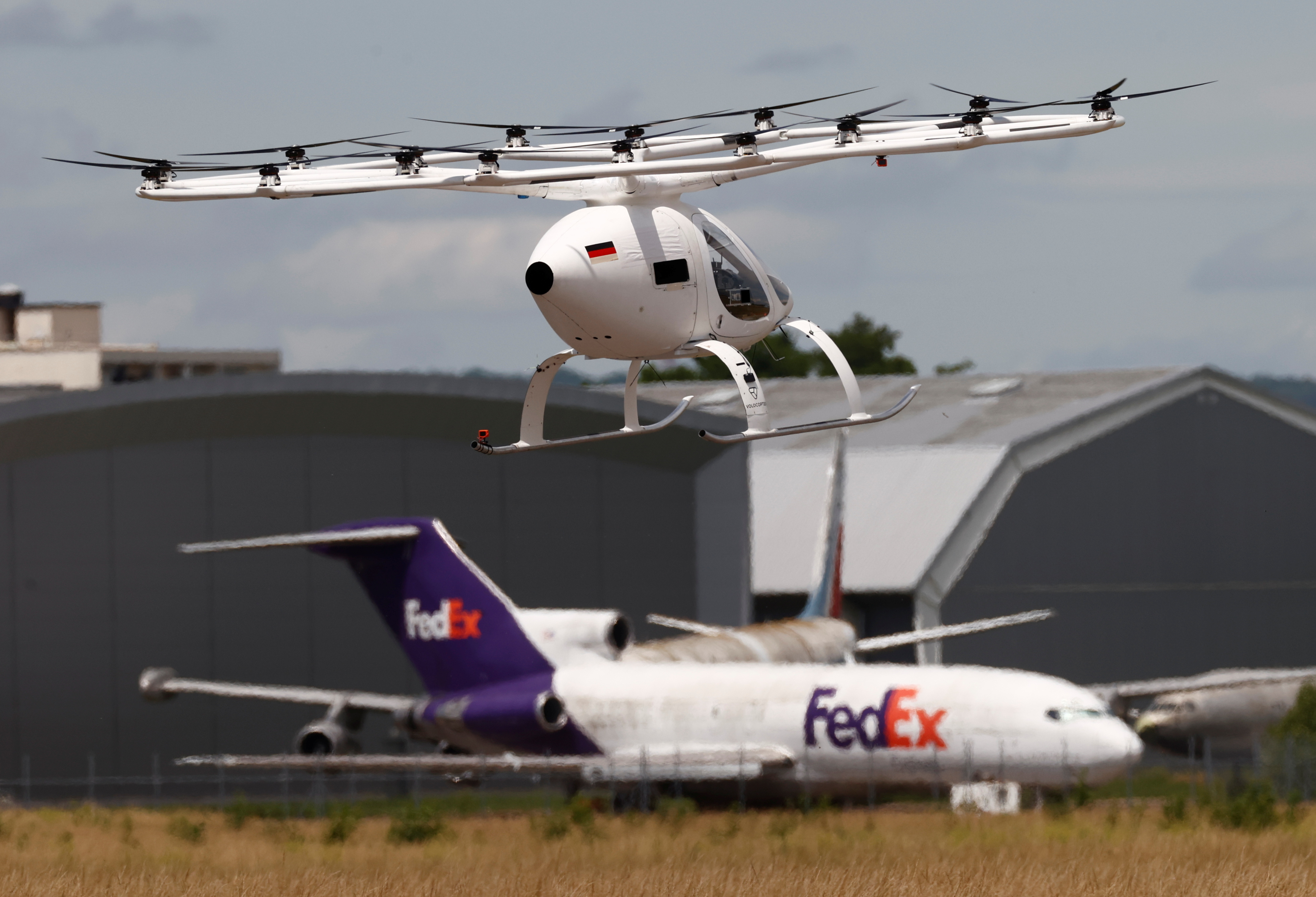 A Volocopter air-taxi performs a flight over Le Bourget airport