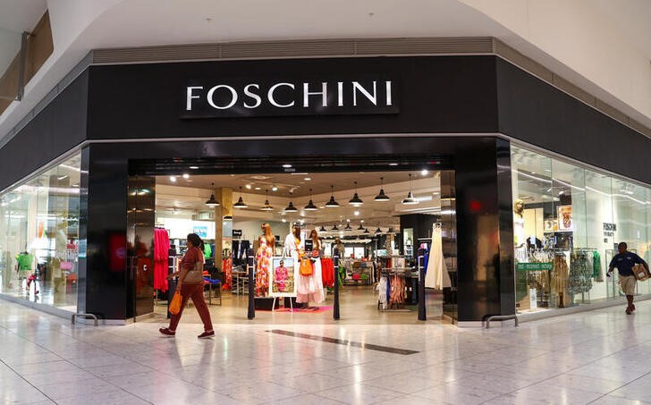Shopper walks past a Foschini store at a shopping centre in Johannesburg