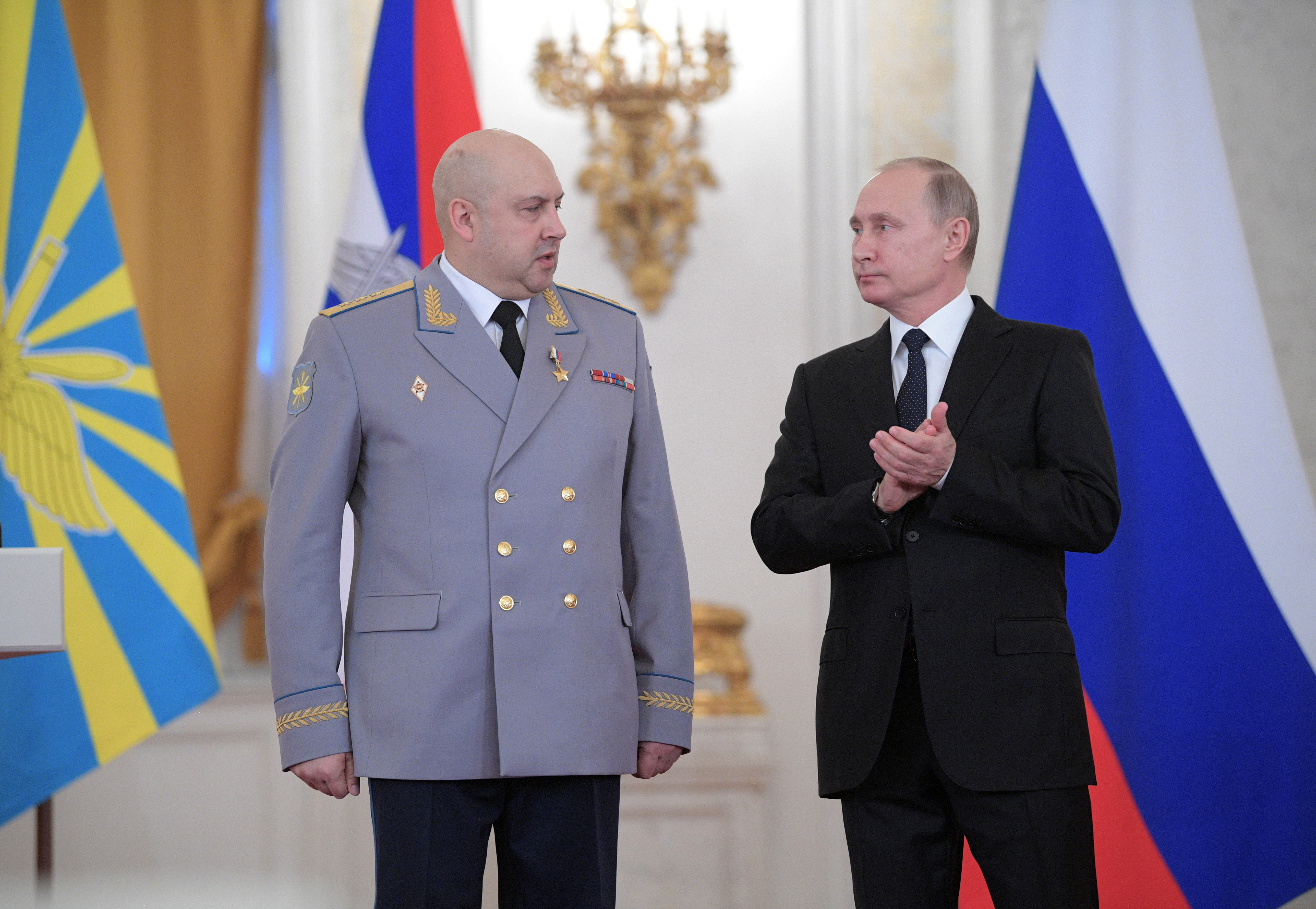 Russian President Vladimir Putin and Colonel General Sergei Surovikin, commander of Russian forces in Syria, attend a state awards ceremony for military personnel who served in Syria, at the Kremlin in Moscow