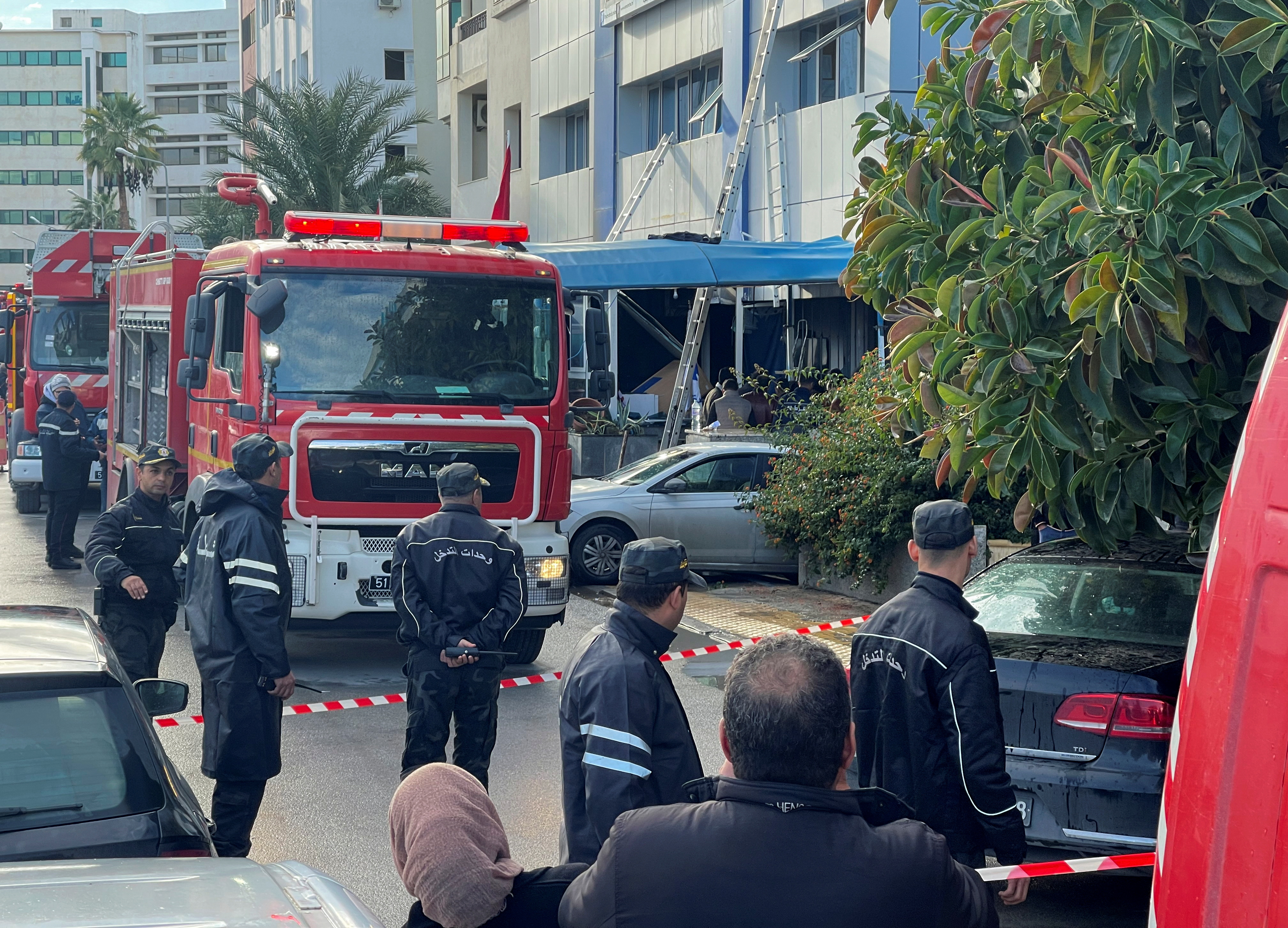 Security forces stand outside the headquarters of Tunisia's Ennahda party after a fire broke out a the building in Tunis, Tunisia December 9, 2021. REUTERS/Jihed Abidellaoui