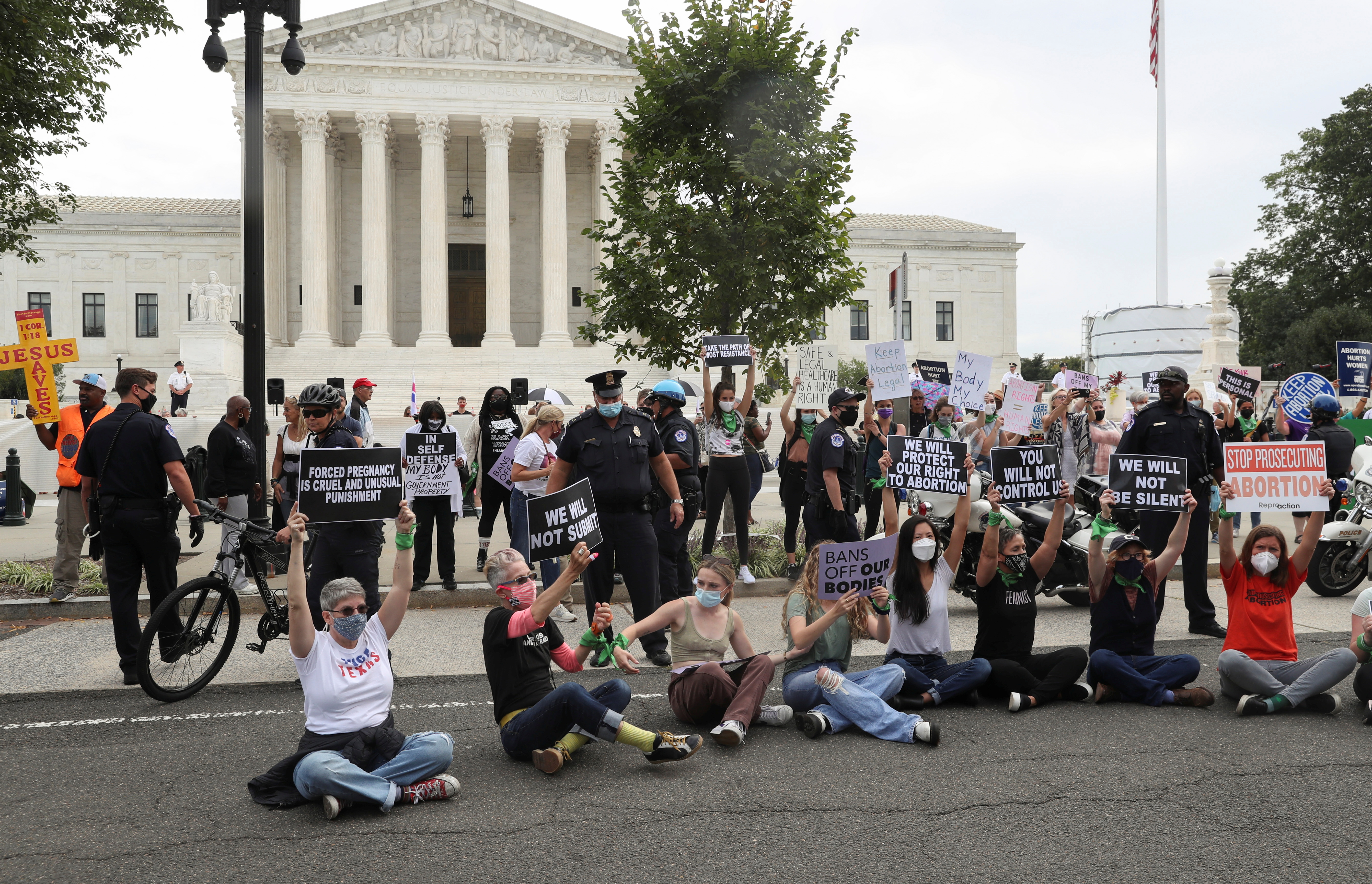 People protest for and against abortion rights outside of the U.S. Supreme Court building in Washington