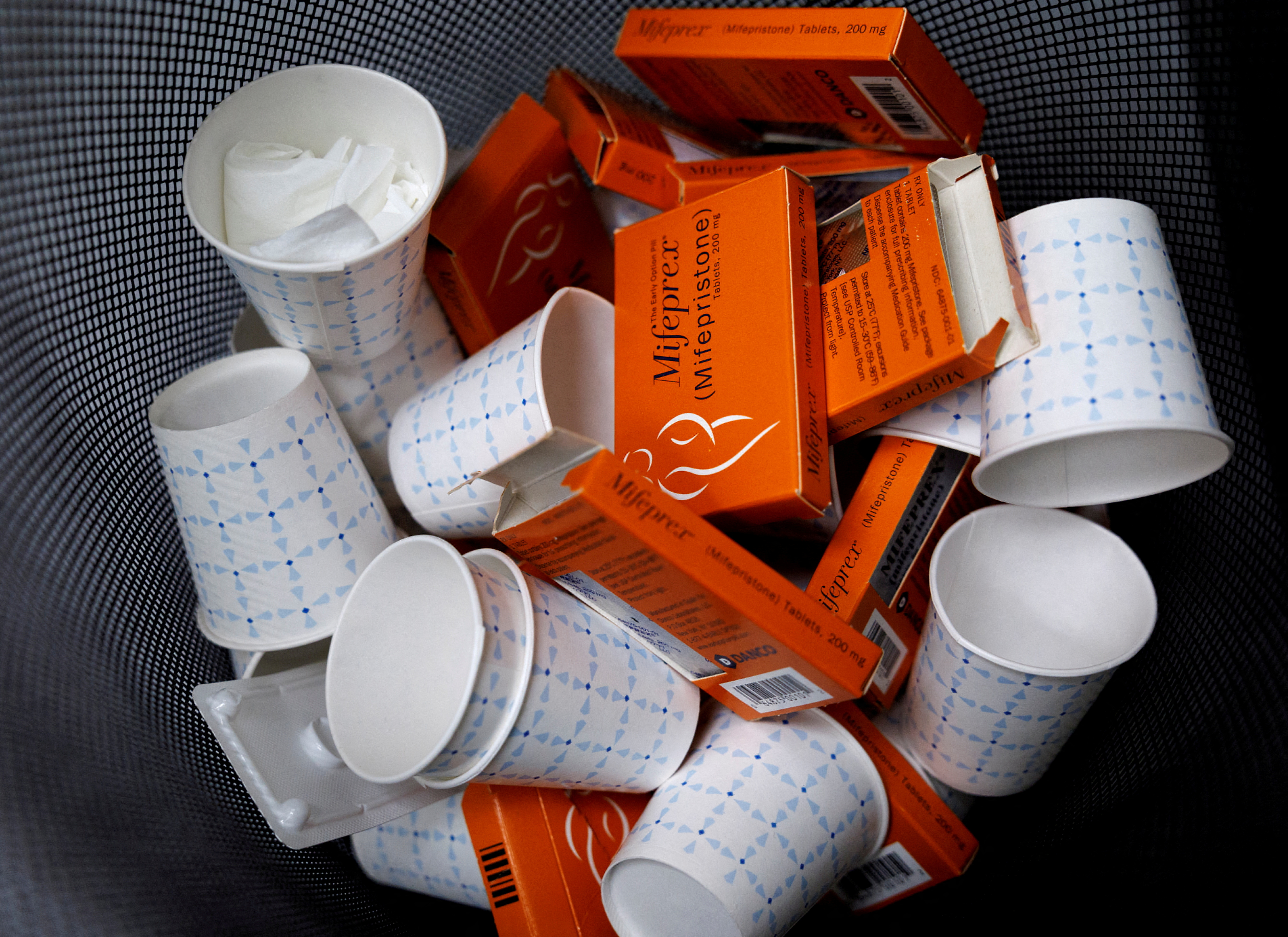 Used boxes of Mifepristone pills, the first drug used in a medical abortion, fill a trash can at Alamo Women's Clinic in New Mexico