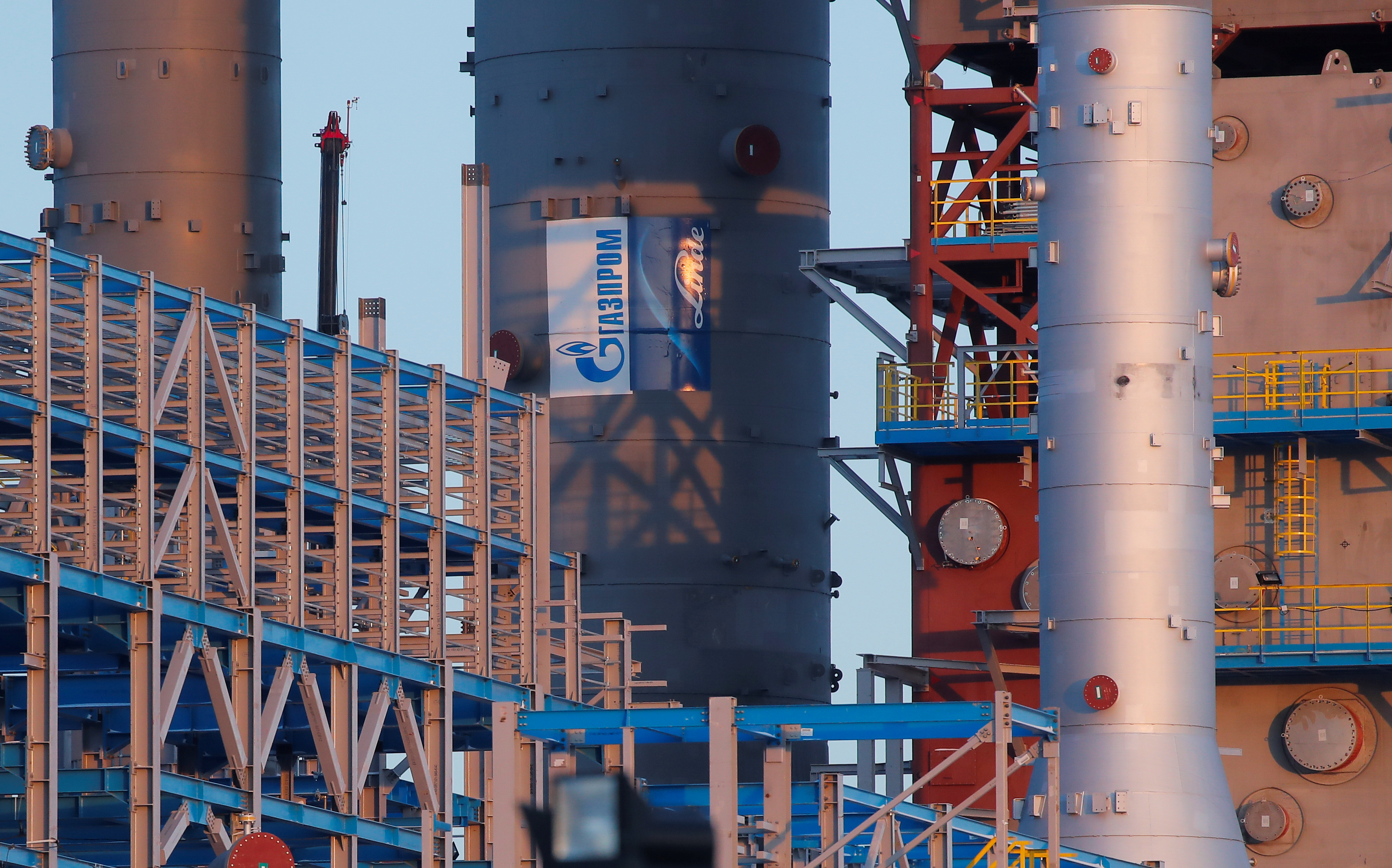 Gazprom logo is seen on a gas processing column under construction at Amur gas processing plant, part of Power Of Siberia project outside the far eastern town of Svobodny