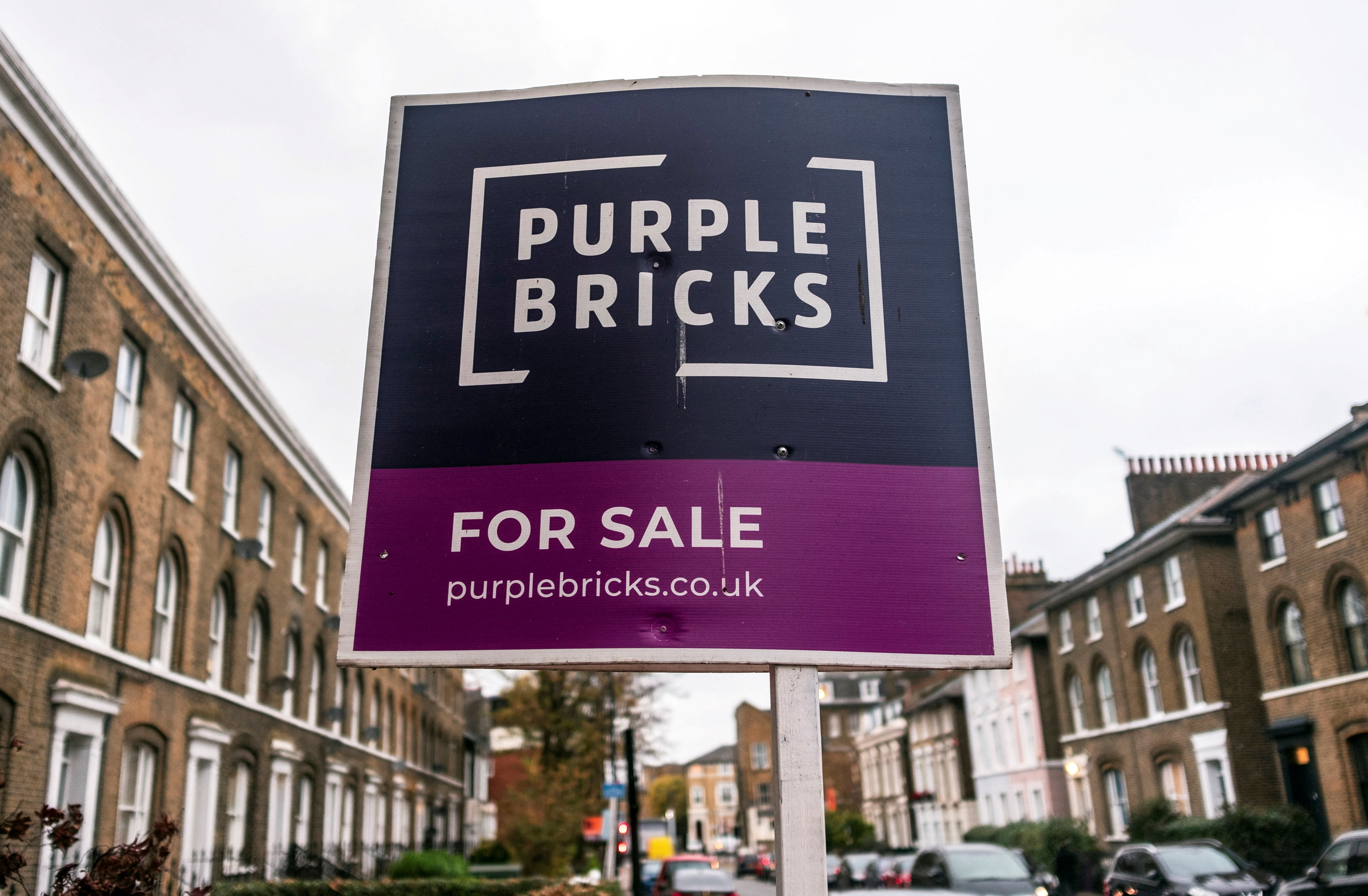Sign for online estate agent Purplebricks is pictured outside a property in London