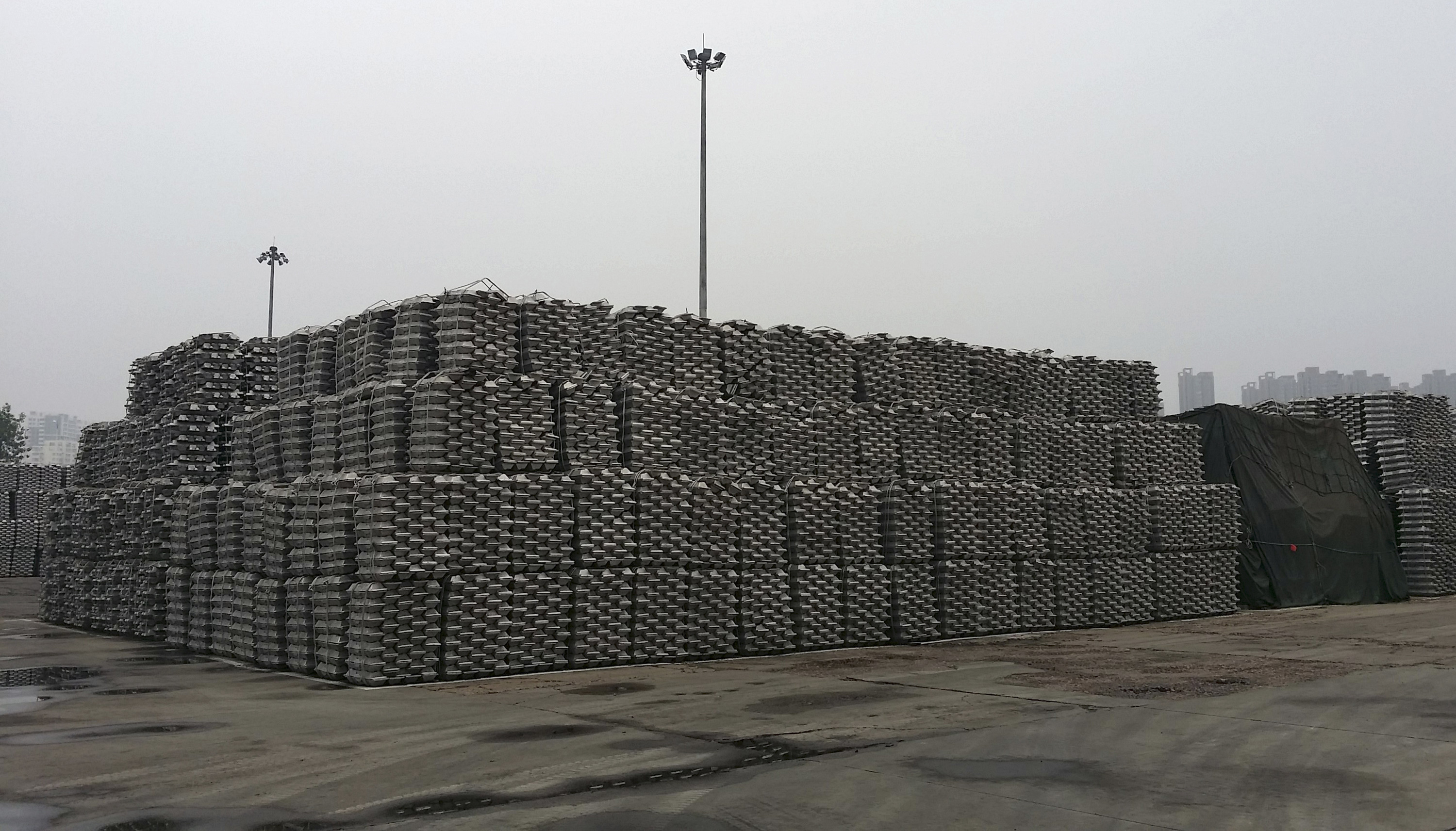 Aluminum ingots are piled up at a bonded storage area at the Dagang Terminal of Qingdao Port