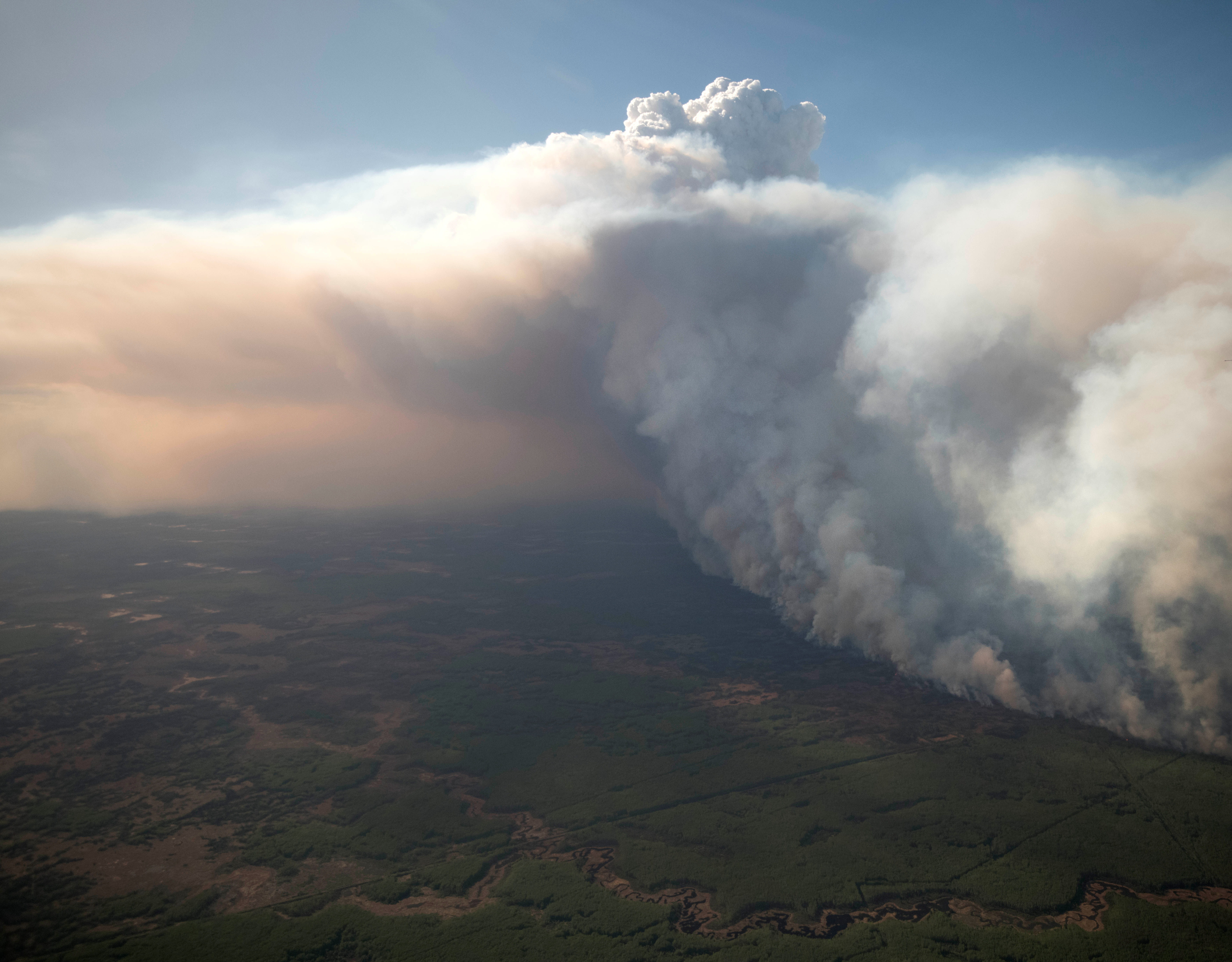 The Chuckegg Creek wildfire burns out of control in the High Level Forest Area