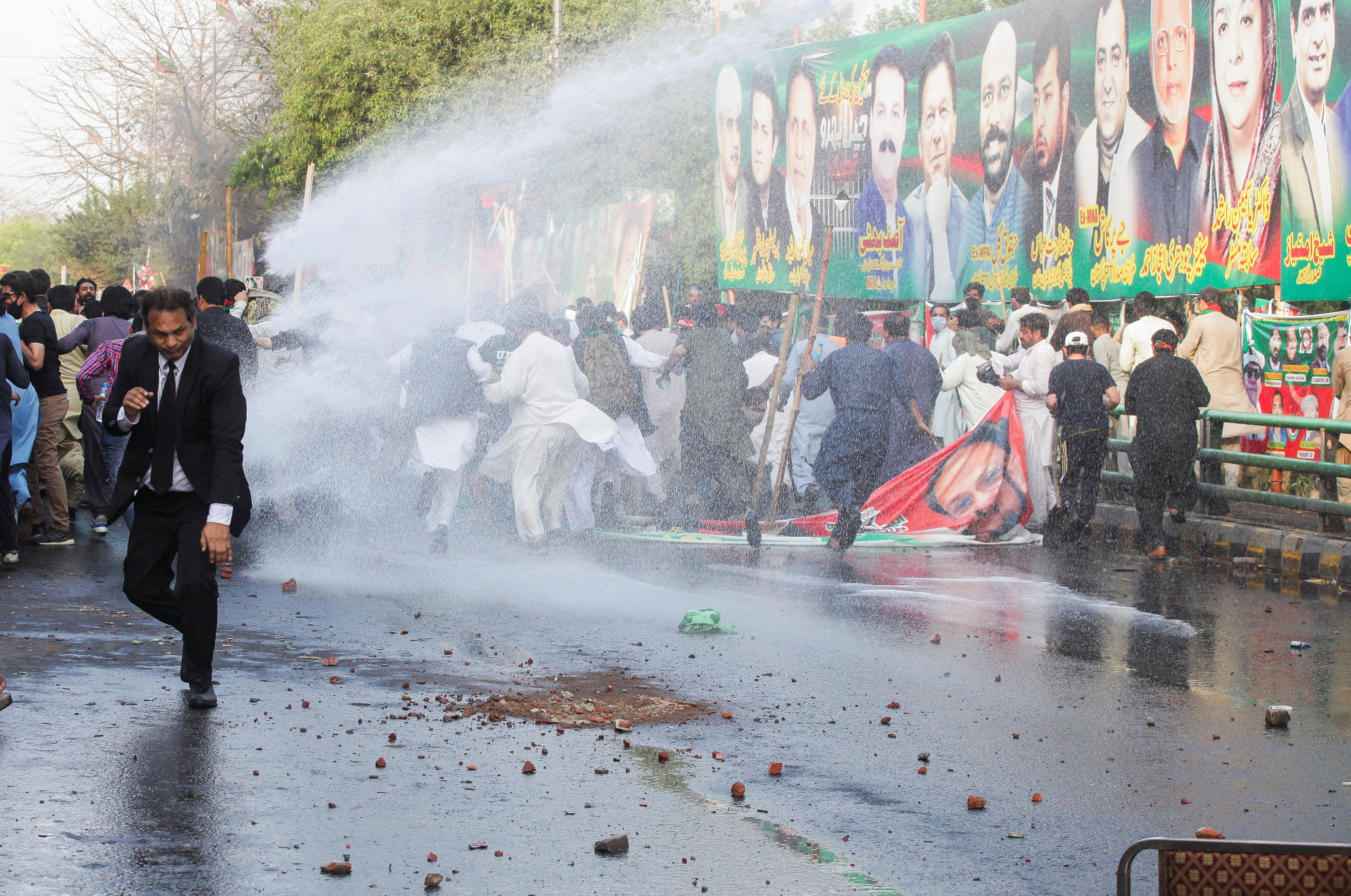 Supporters of former Pakistani PM Khan clash with police ahead of his possible arrest, in Lahore