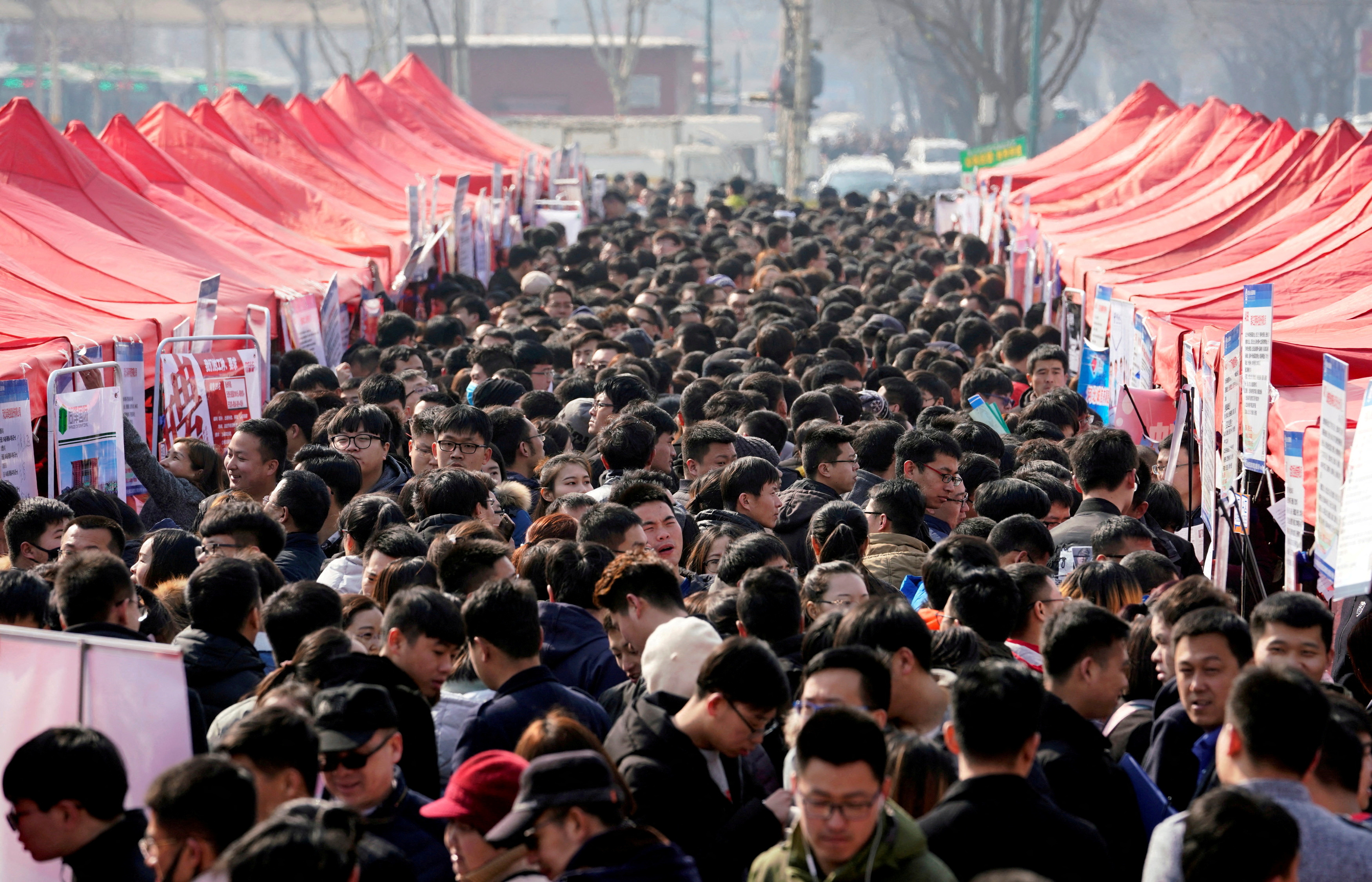 Job seekers crowd a job fair at Liberation Square in Shijiazhuang