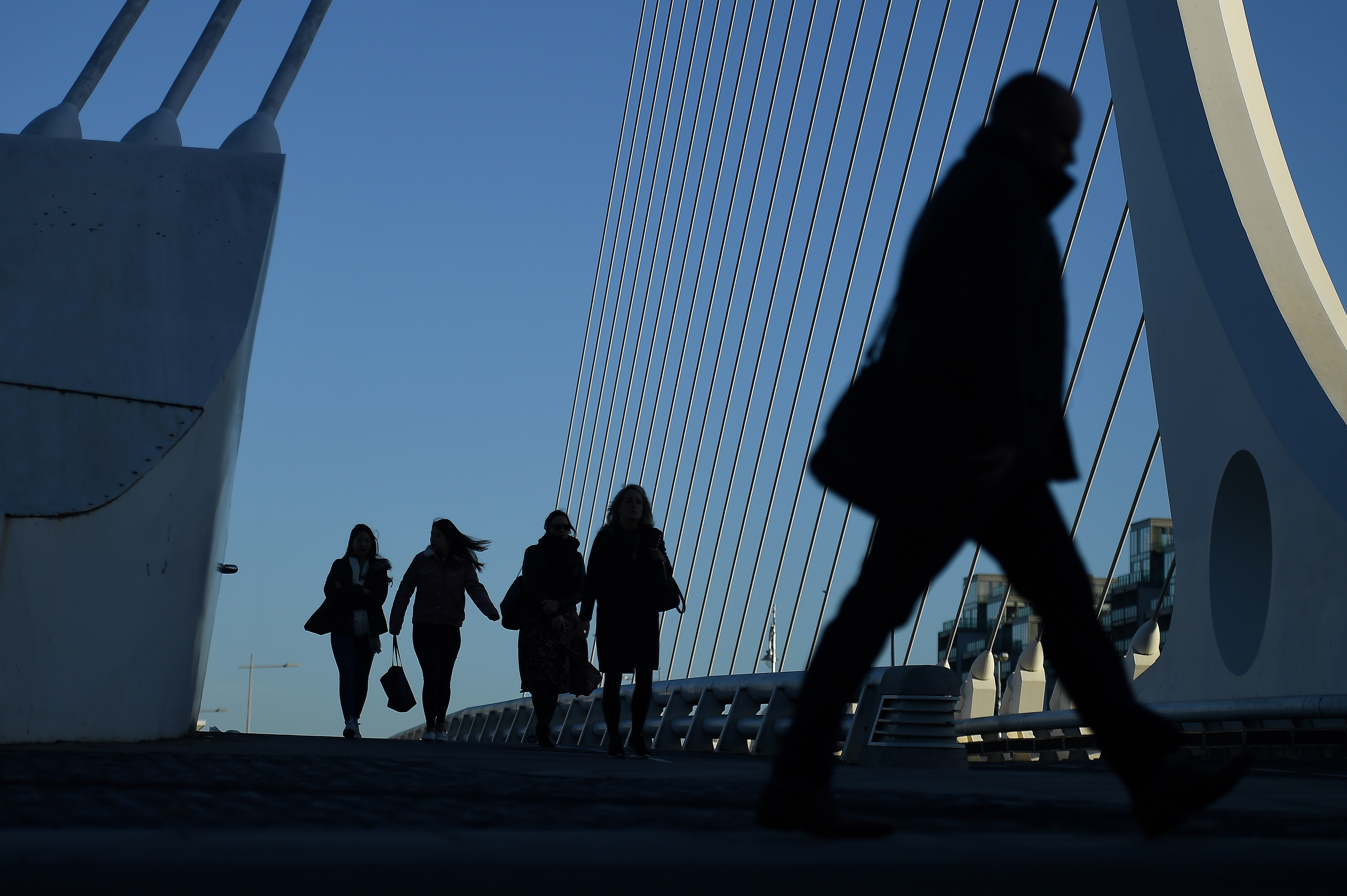 Commuters make their way into work in the morning in the financial district of Dublin