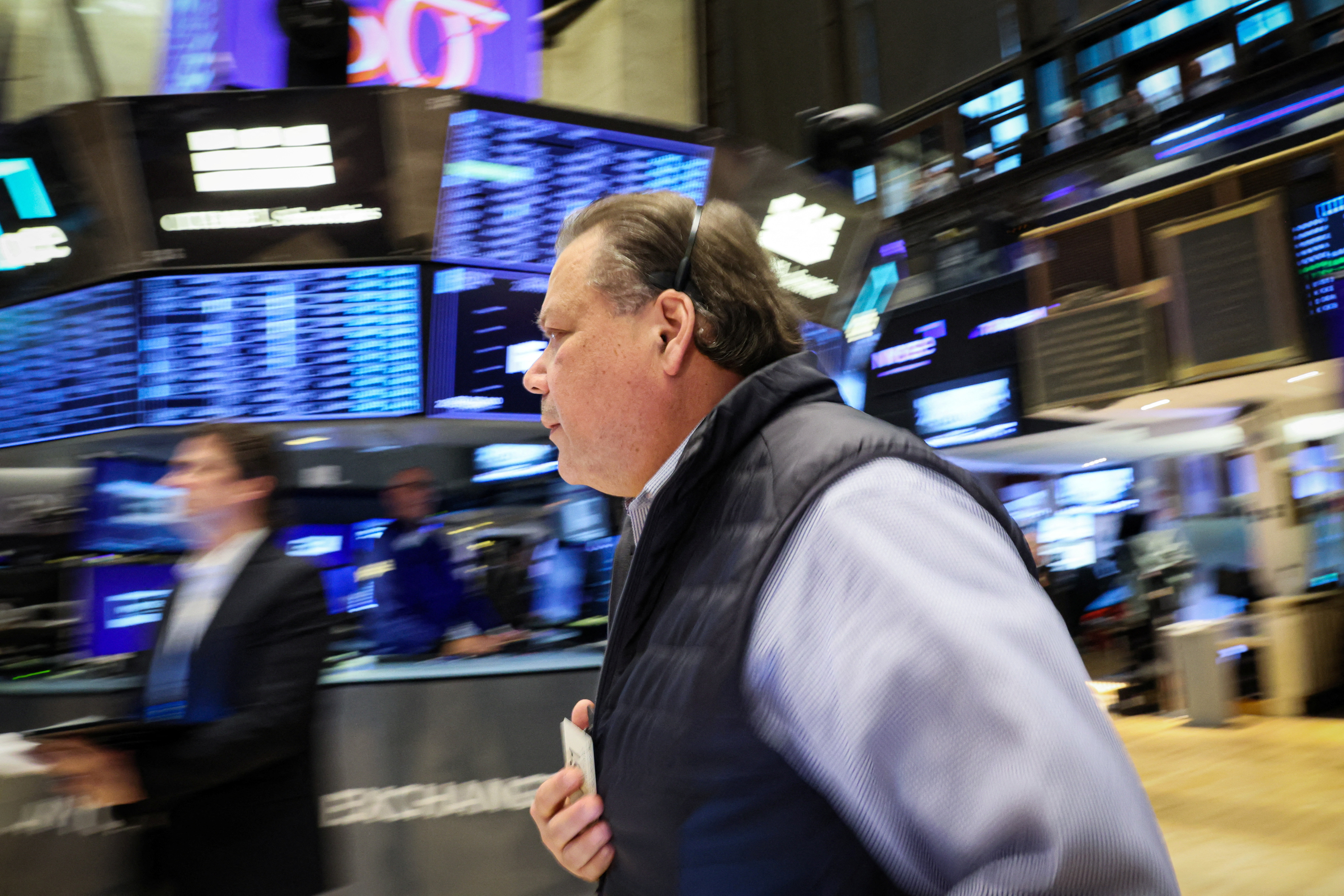 Traders work on the NYSE trading floor in New York