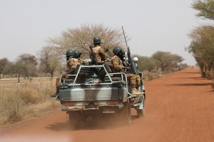 Soldiers from Burkina Faso patrol on the road of Gorgadji in the Sahel area, Burkina Faso
