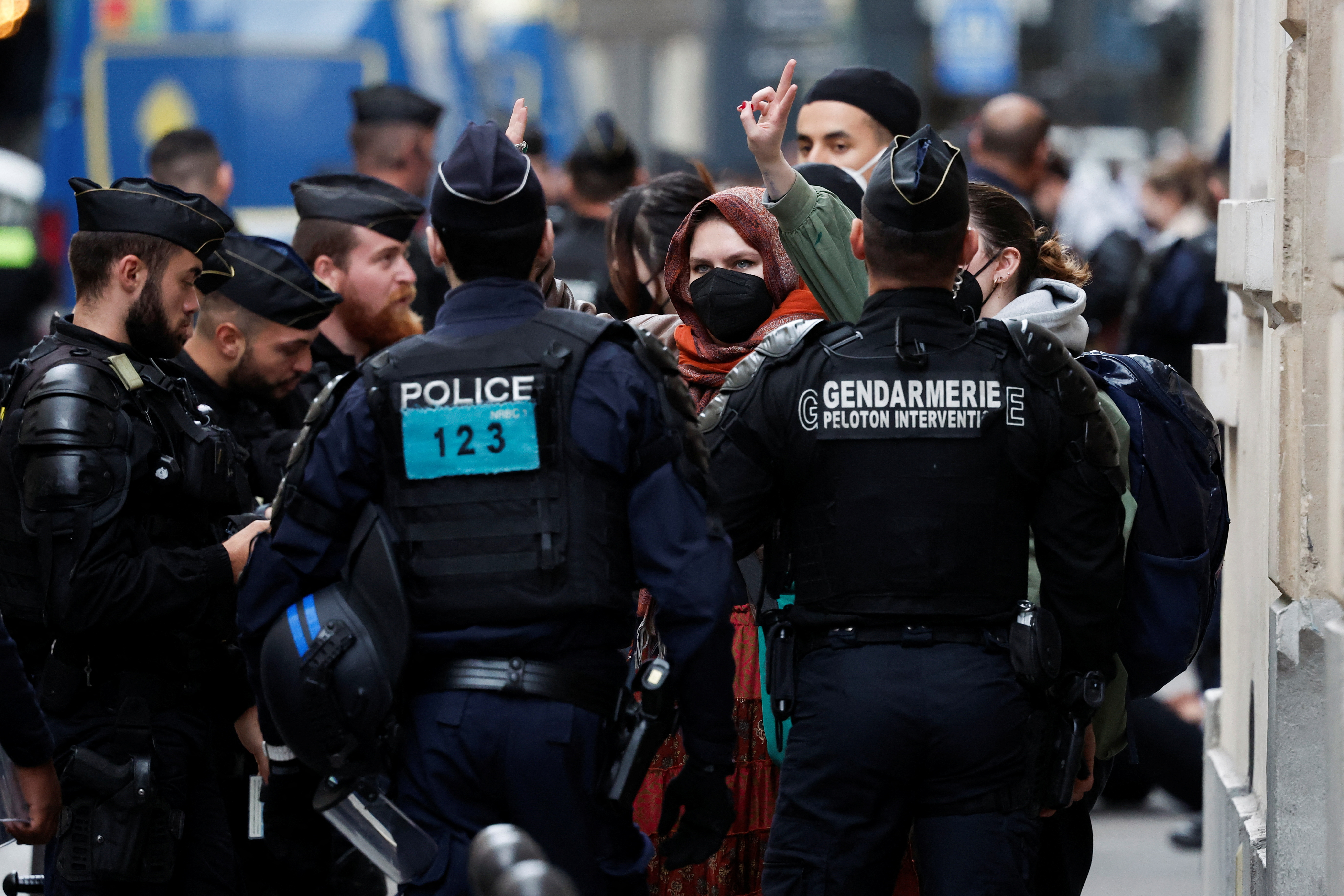 Protesters in support of Palestinians in Gaza are escorted away by police forces during the evacuation of the Sciences Po University, in Paris